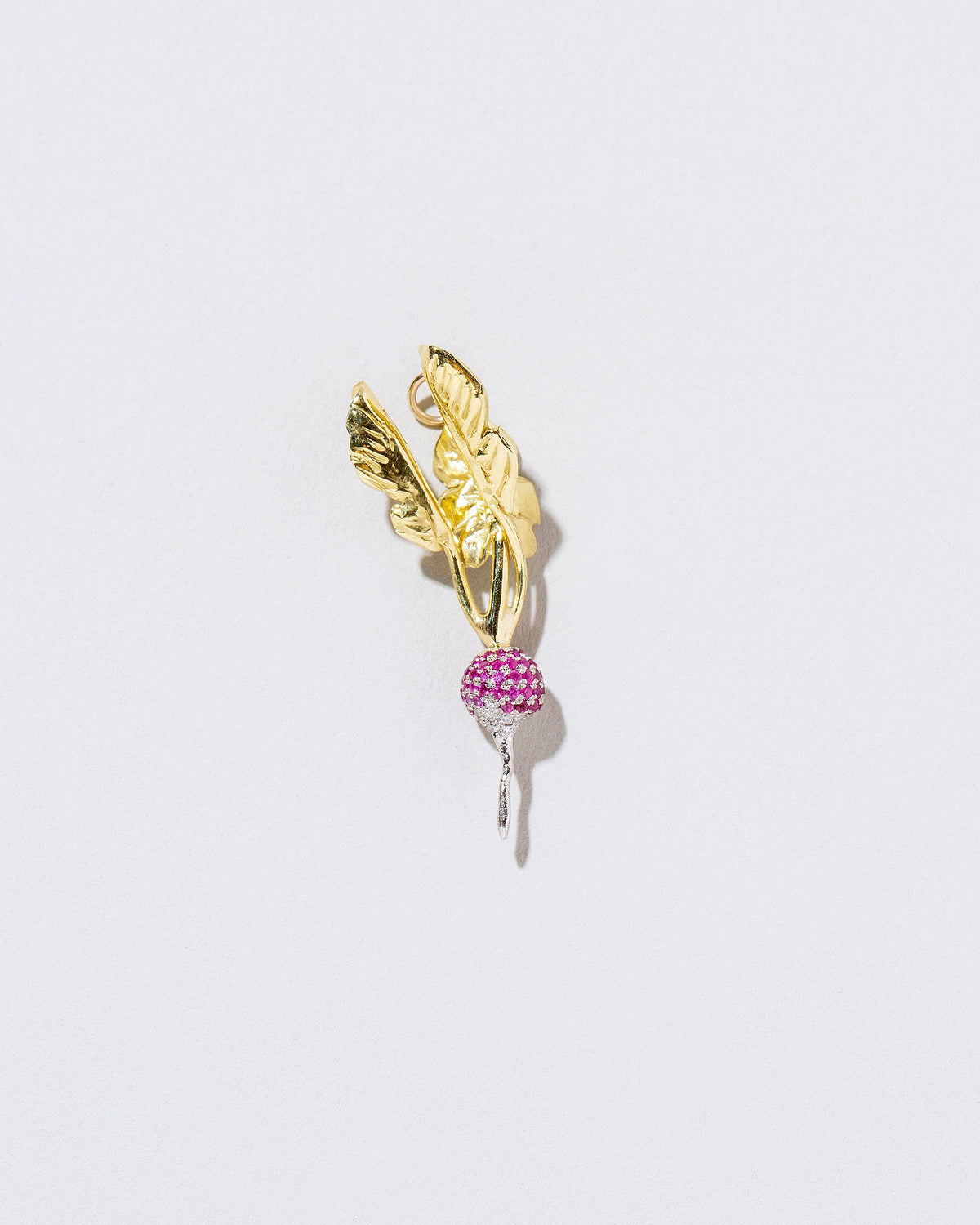  Red Radish Charm on light color background.