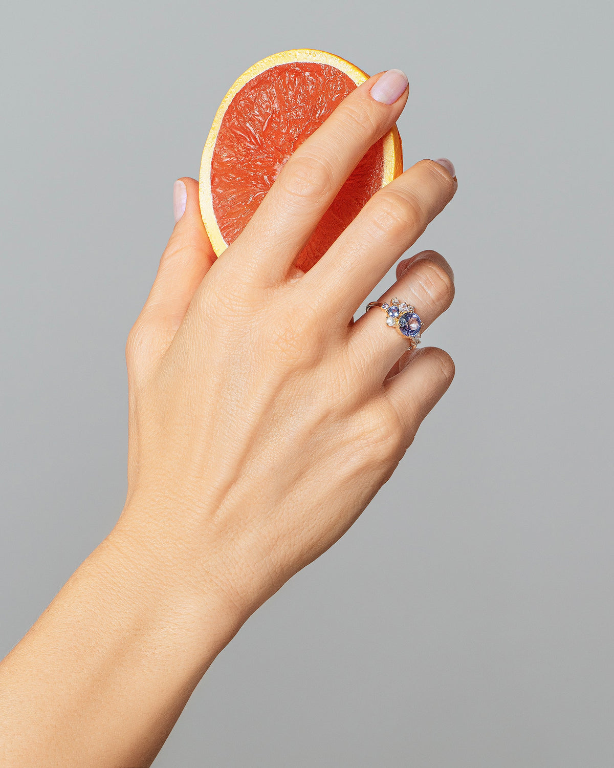 Vega Ring - Bicolor Sapphire on model.