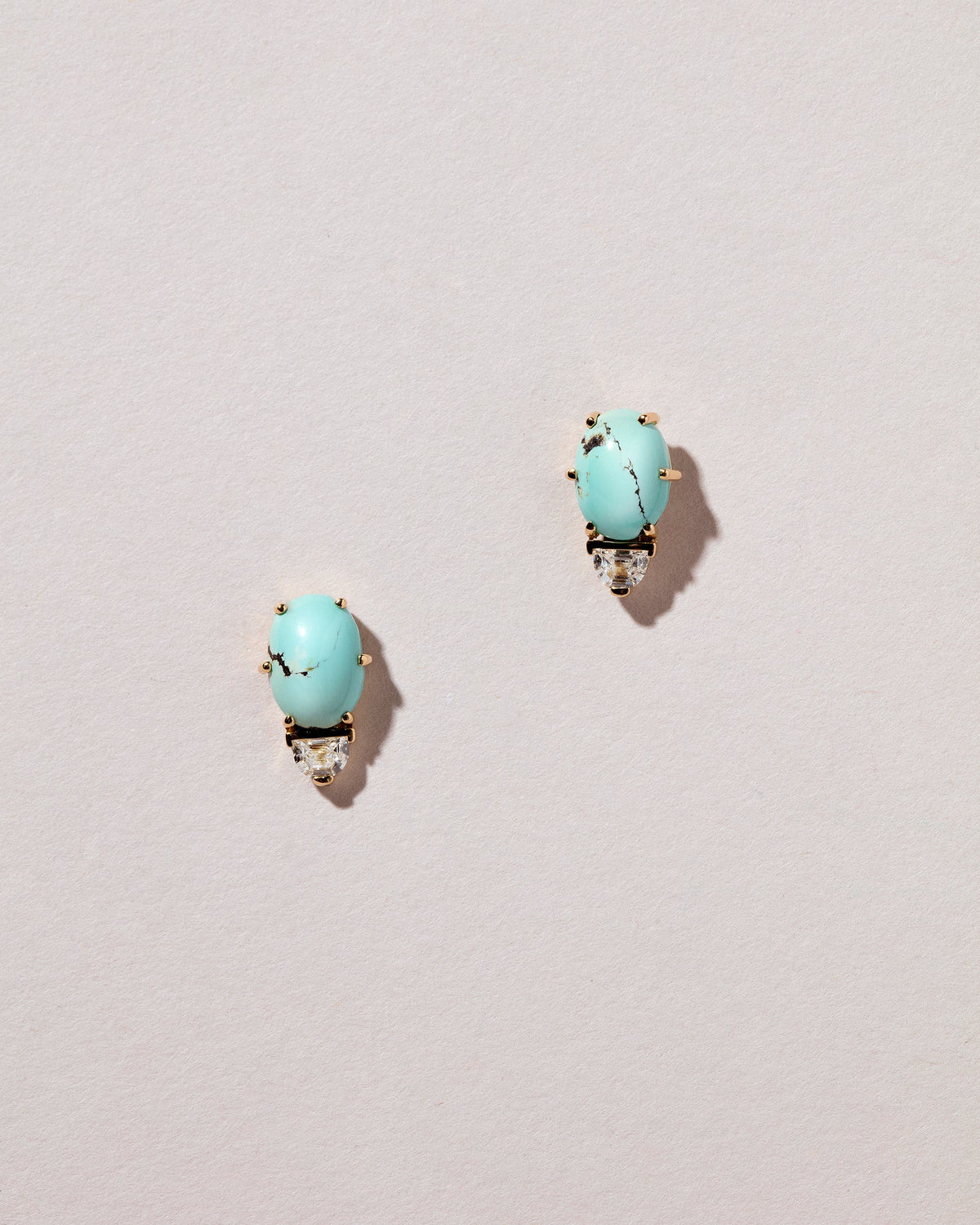  Divine Protection Earrings on light color background.