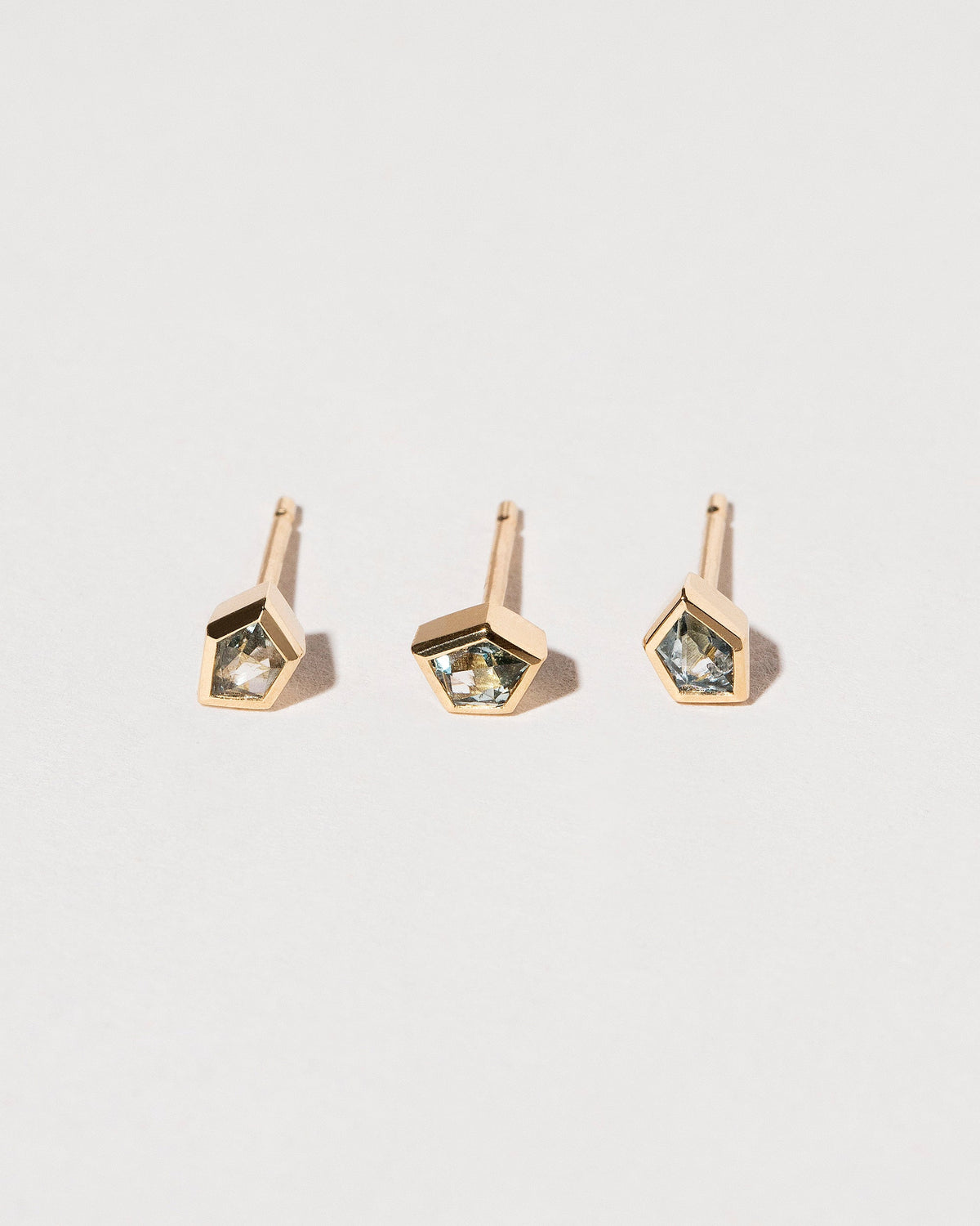  Geo Sapphire Single Stud on light color background.
