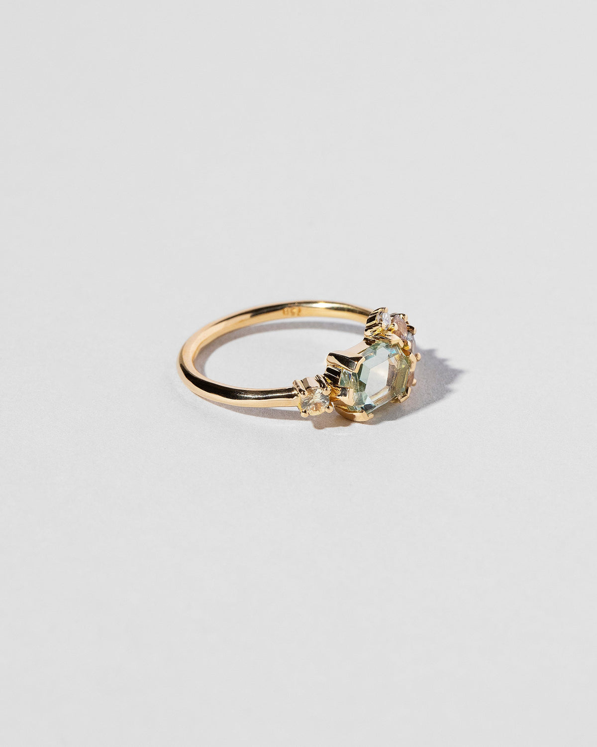  Hexagonal Slice Sapphire Cluster Ring on light color background.