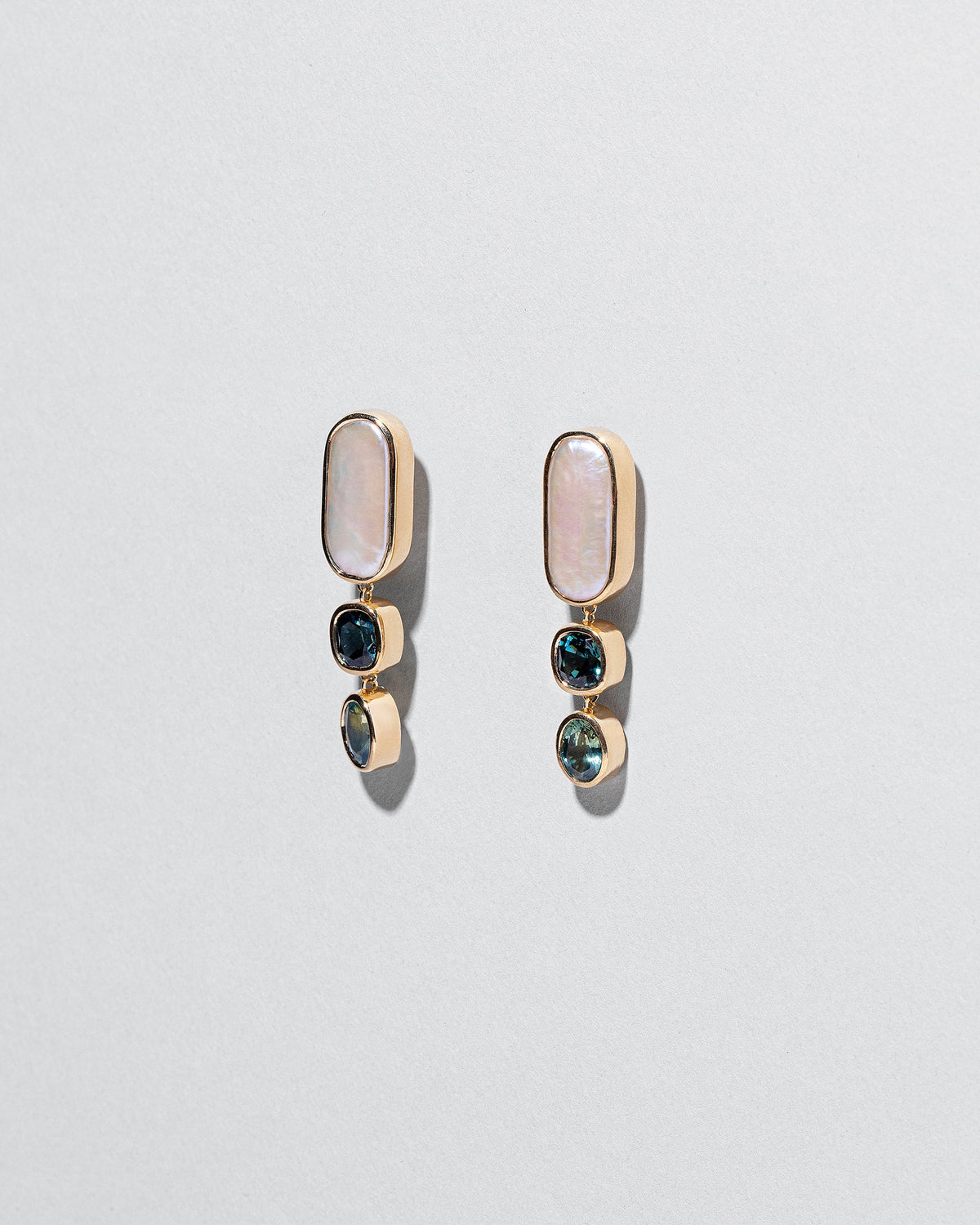  Luster Earrings on light color background.