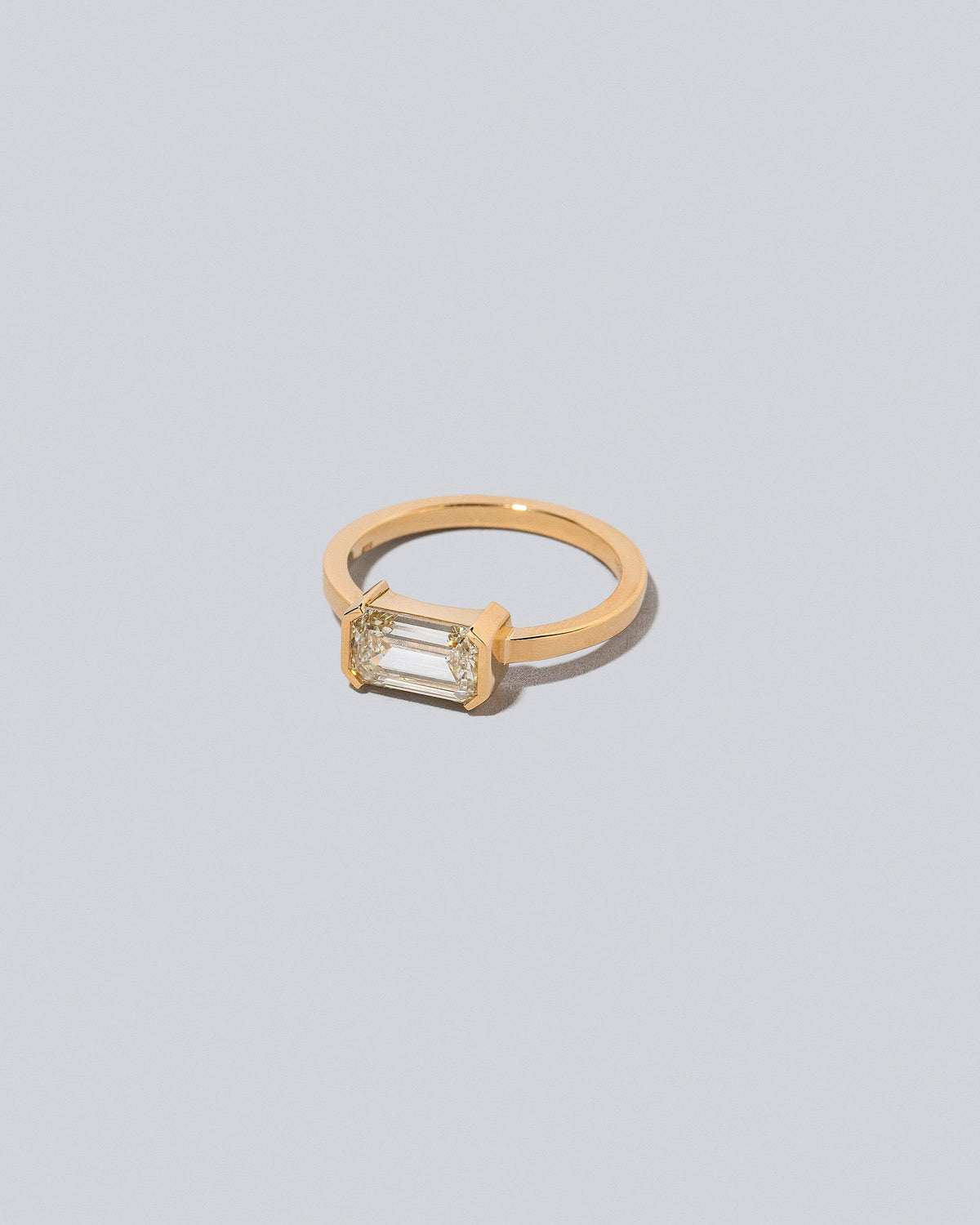 View from the side of the Analogue Ring on light color background.
