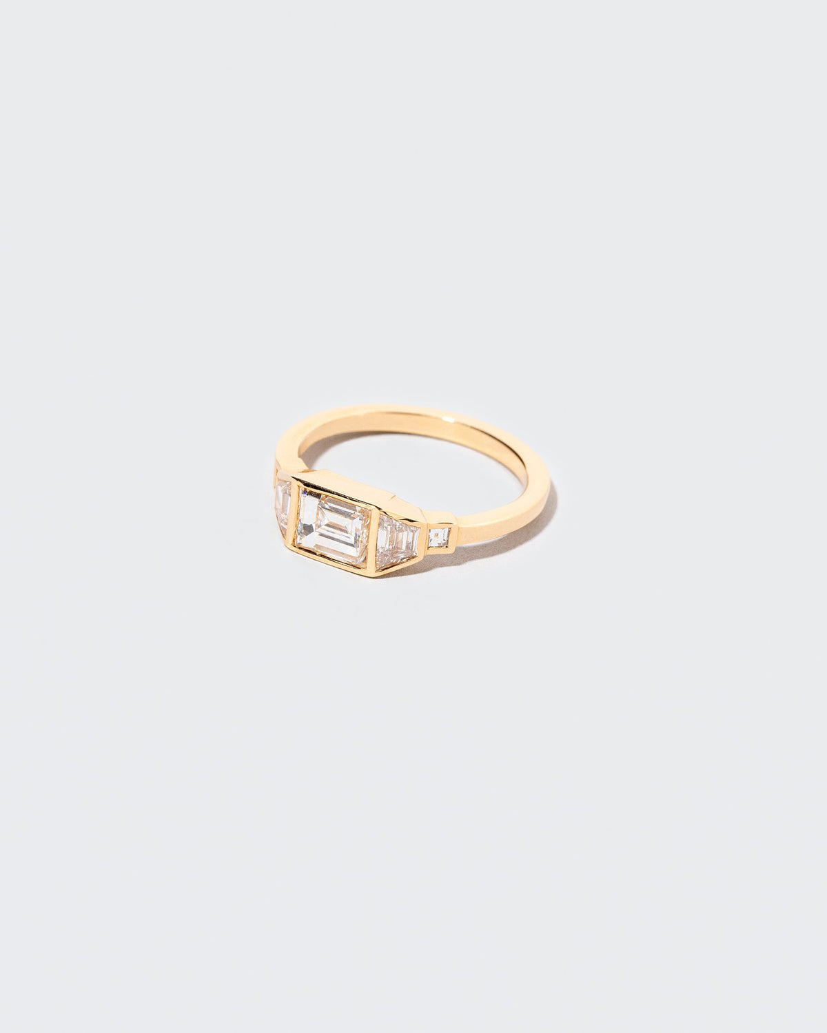 View from the side of the Venus Carré Ring on light color background.