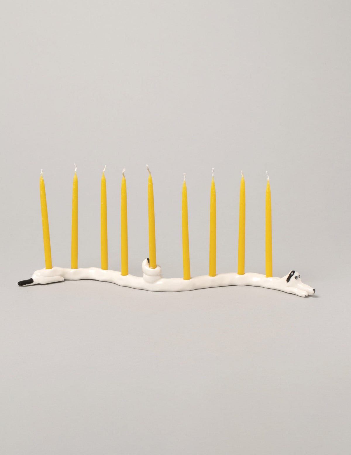 Detail view of the Eleonor Boström Black Ears Dog Menorah on light color background.