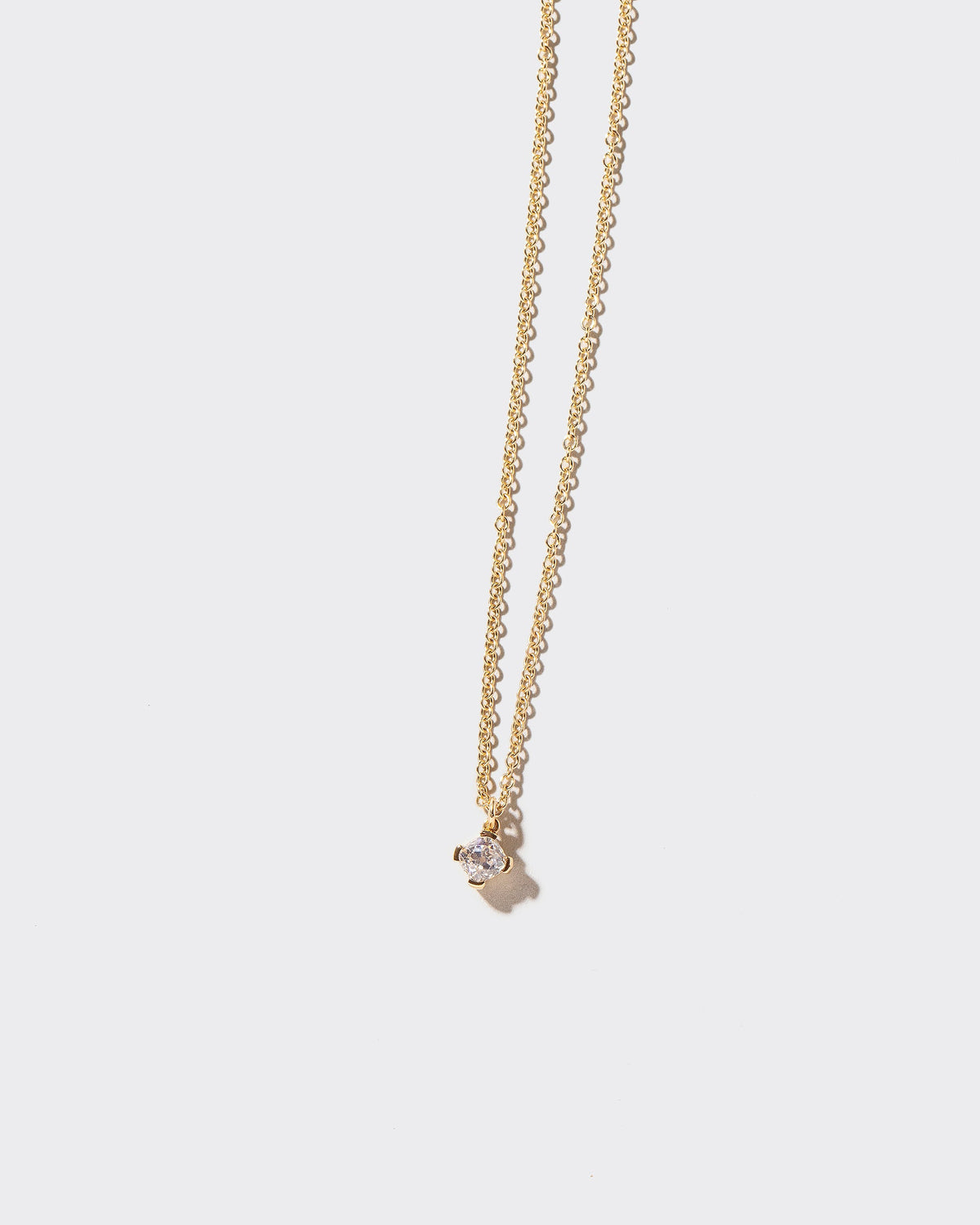  Brille Necklace on light color background.