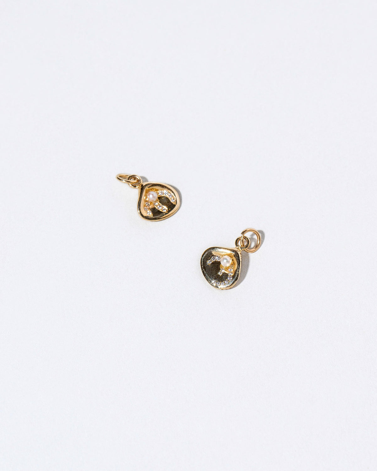  Clams Casino Charm on light color background.