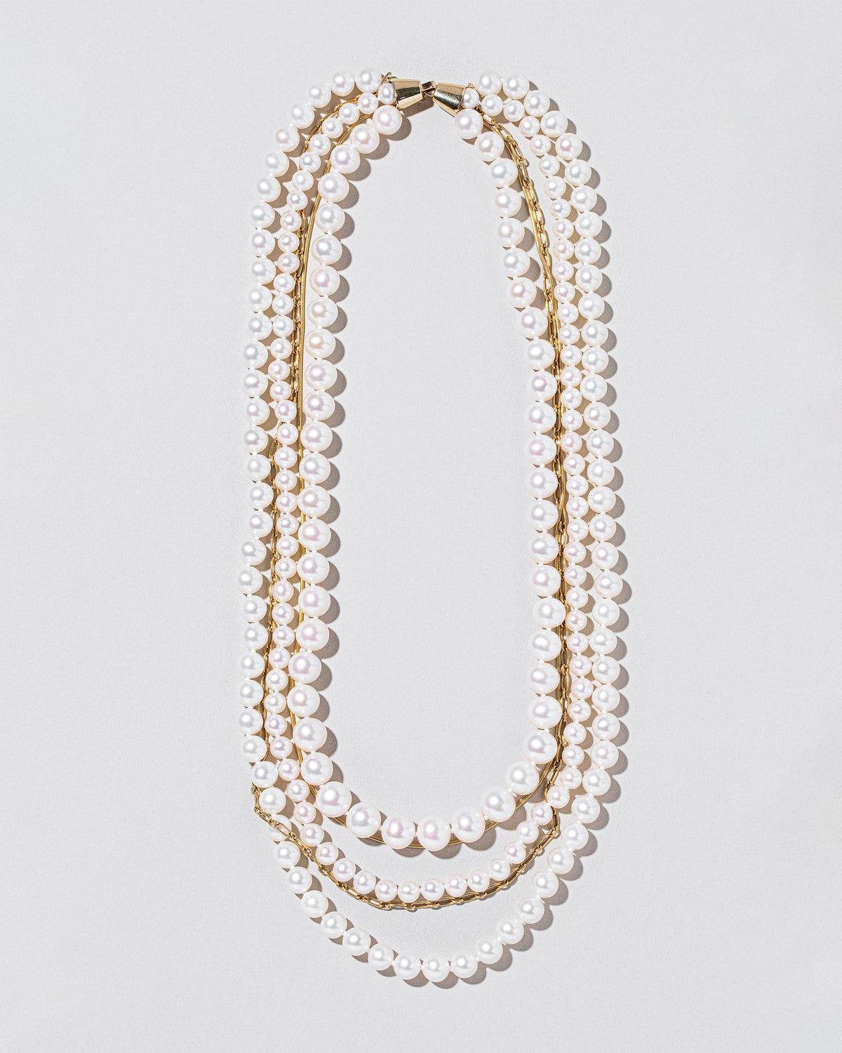  Layered Pearl Necklace on light color background.