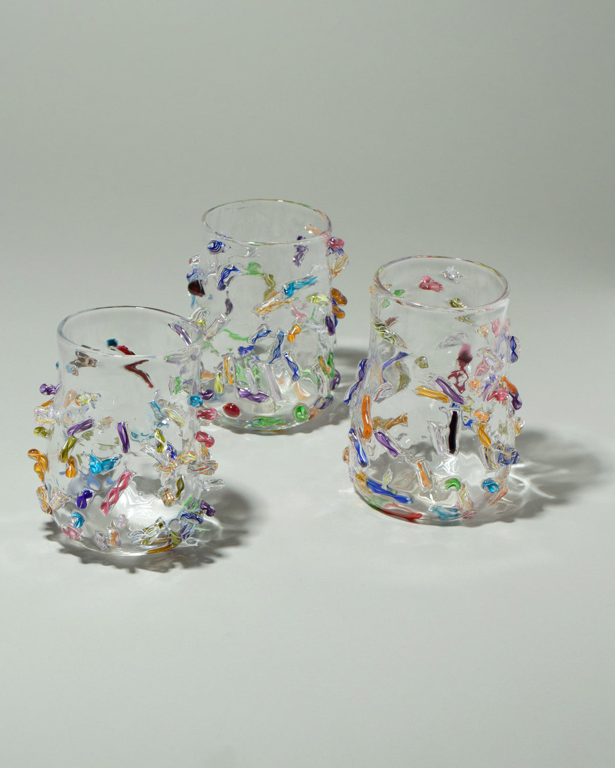 Stover Glass Cane Cups on light color background.
