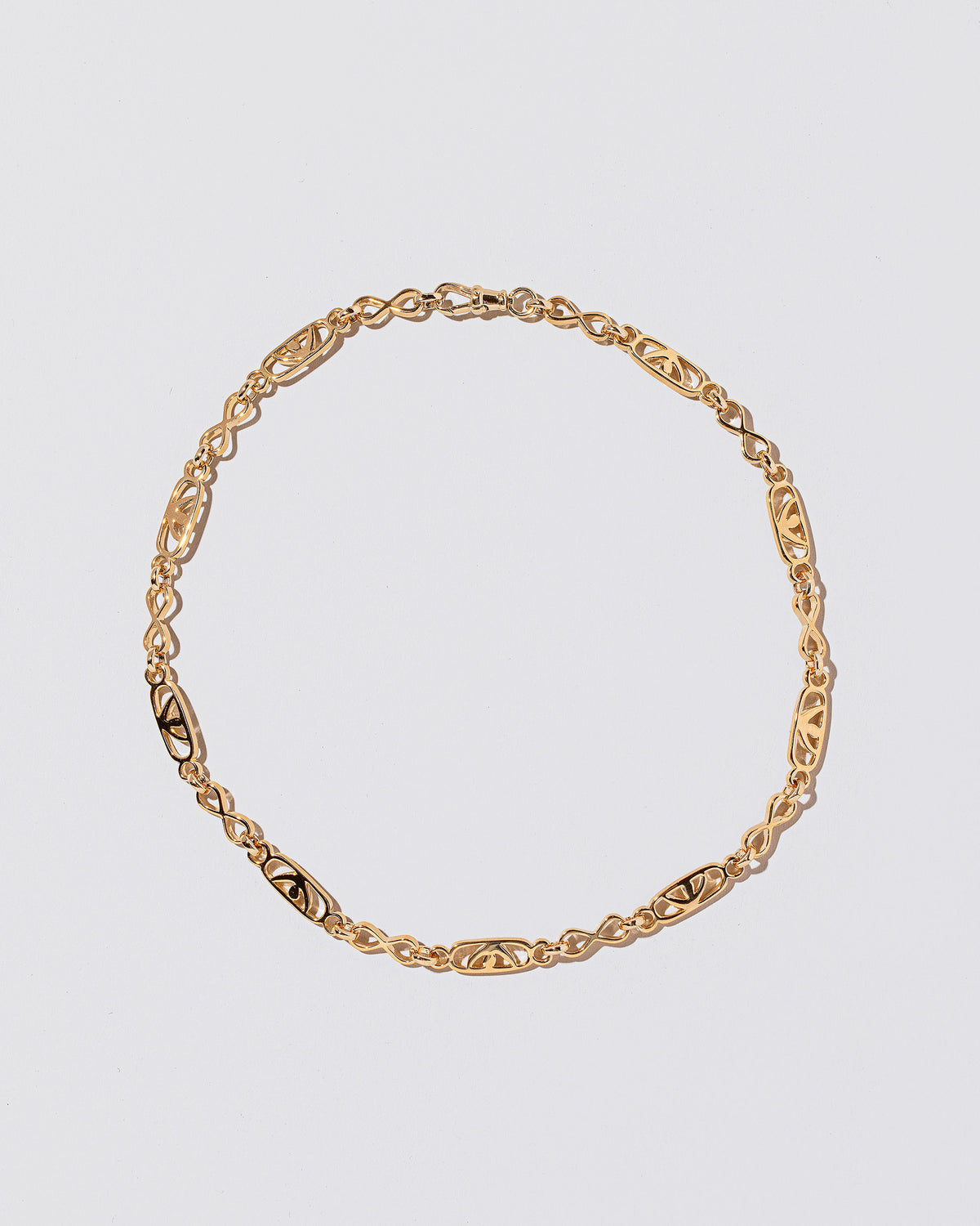 Infinite Spiral Necklace on light color background.
