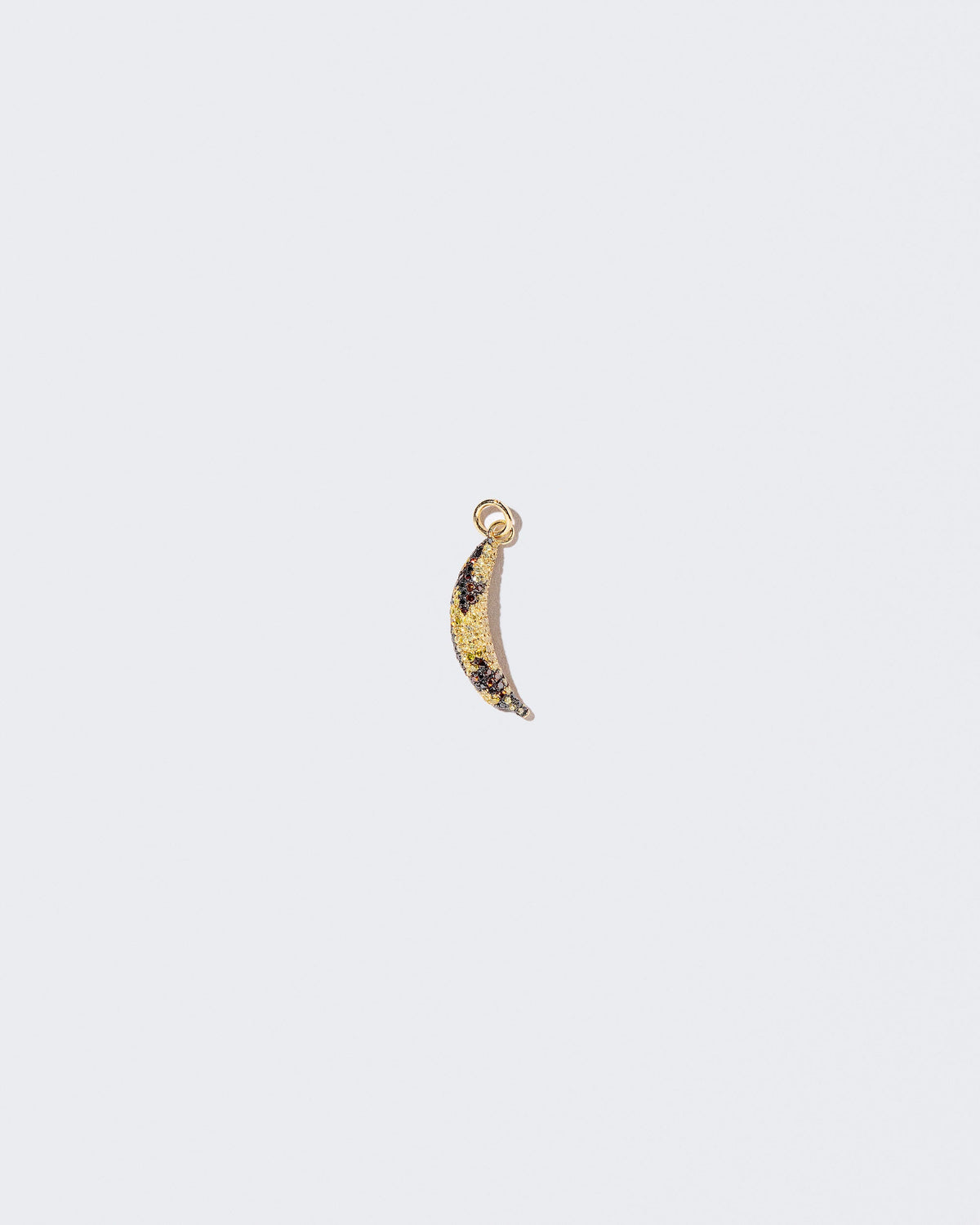 Bruised Banana Charm on light color background.