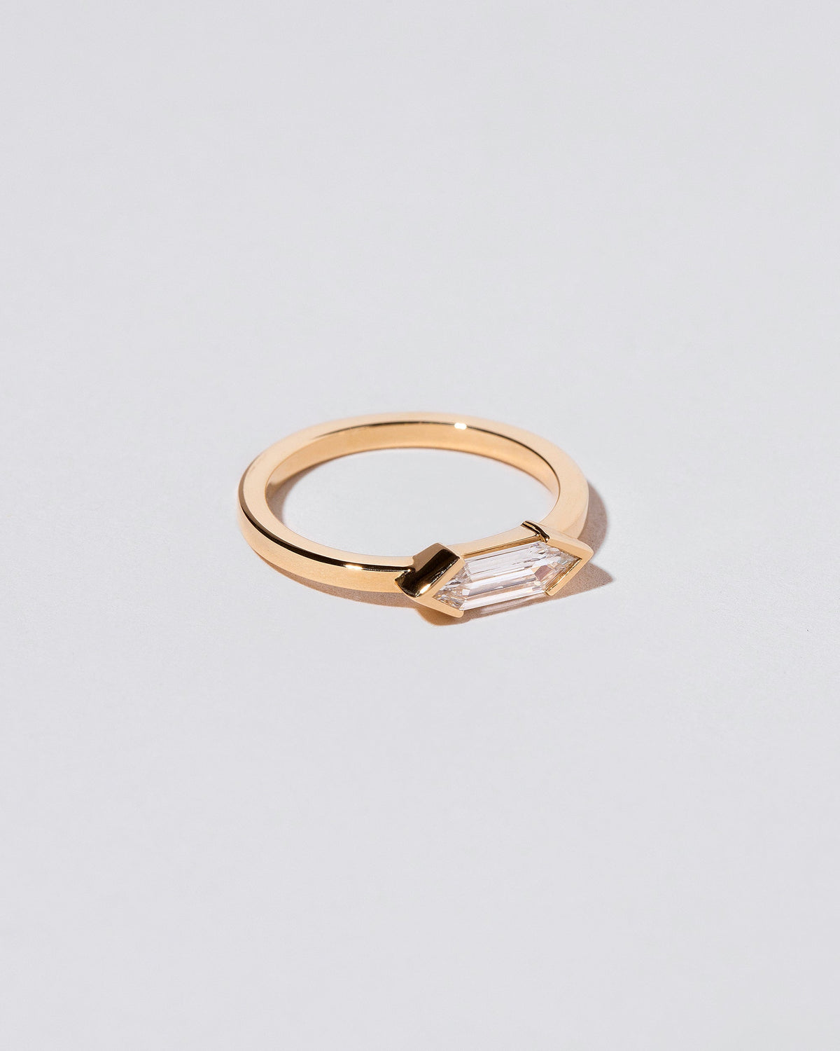 View from the side of the Paradise Ring on light color background.