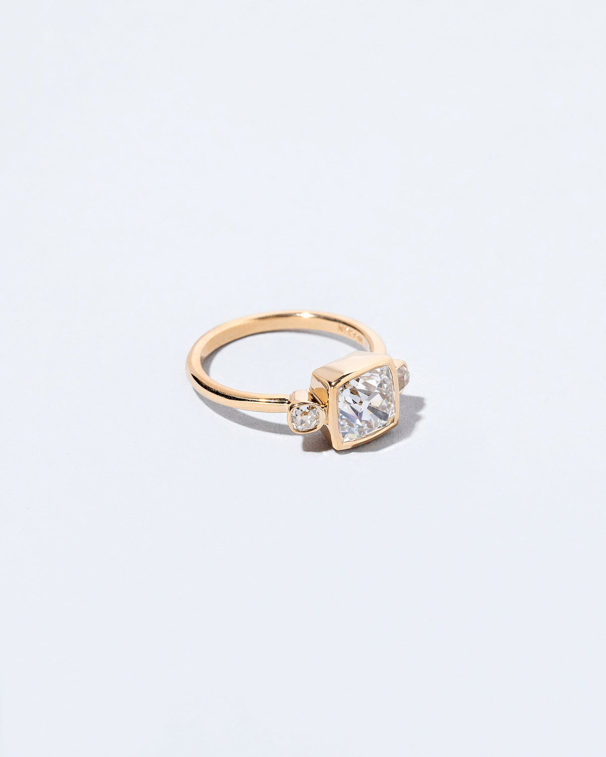  Genesis Ring on light color background.