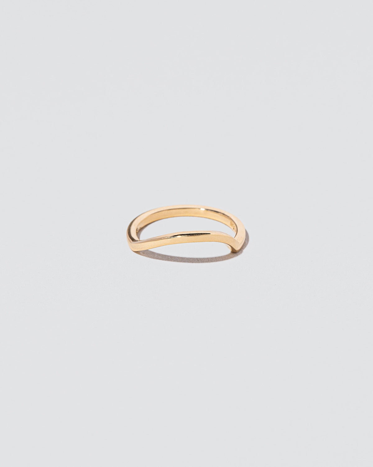 Gold Solid Square Wire Right Slump Band on light color background.