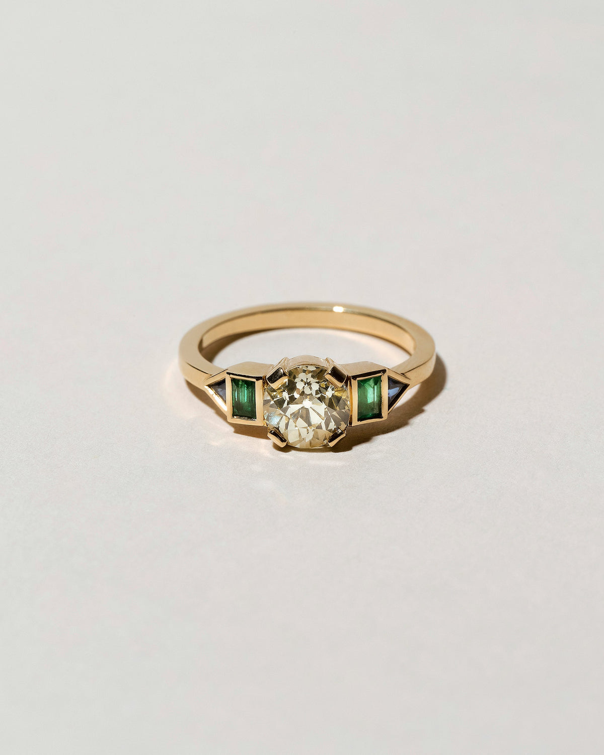  Five Stone Ring on light color background.