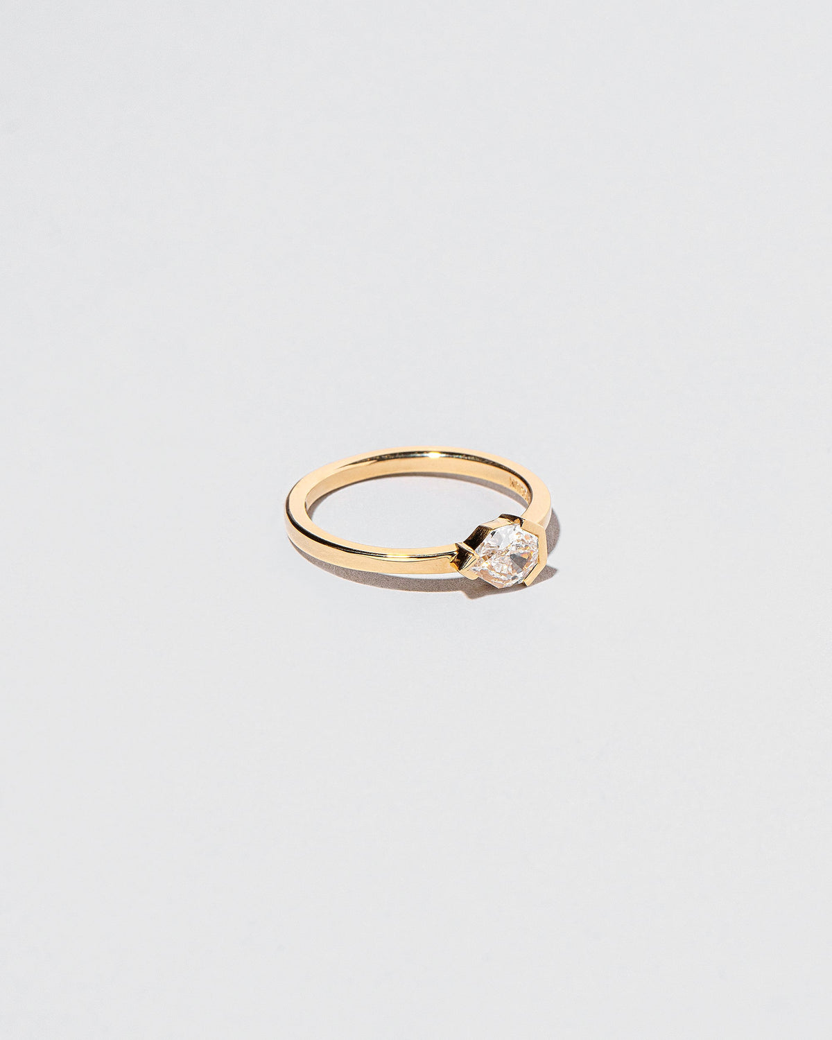 View from the side of the Serenna Ring on light color background.