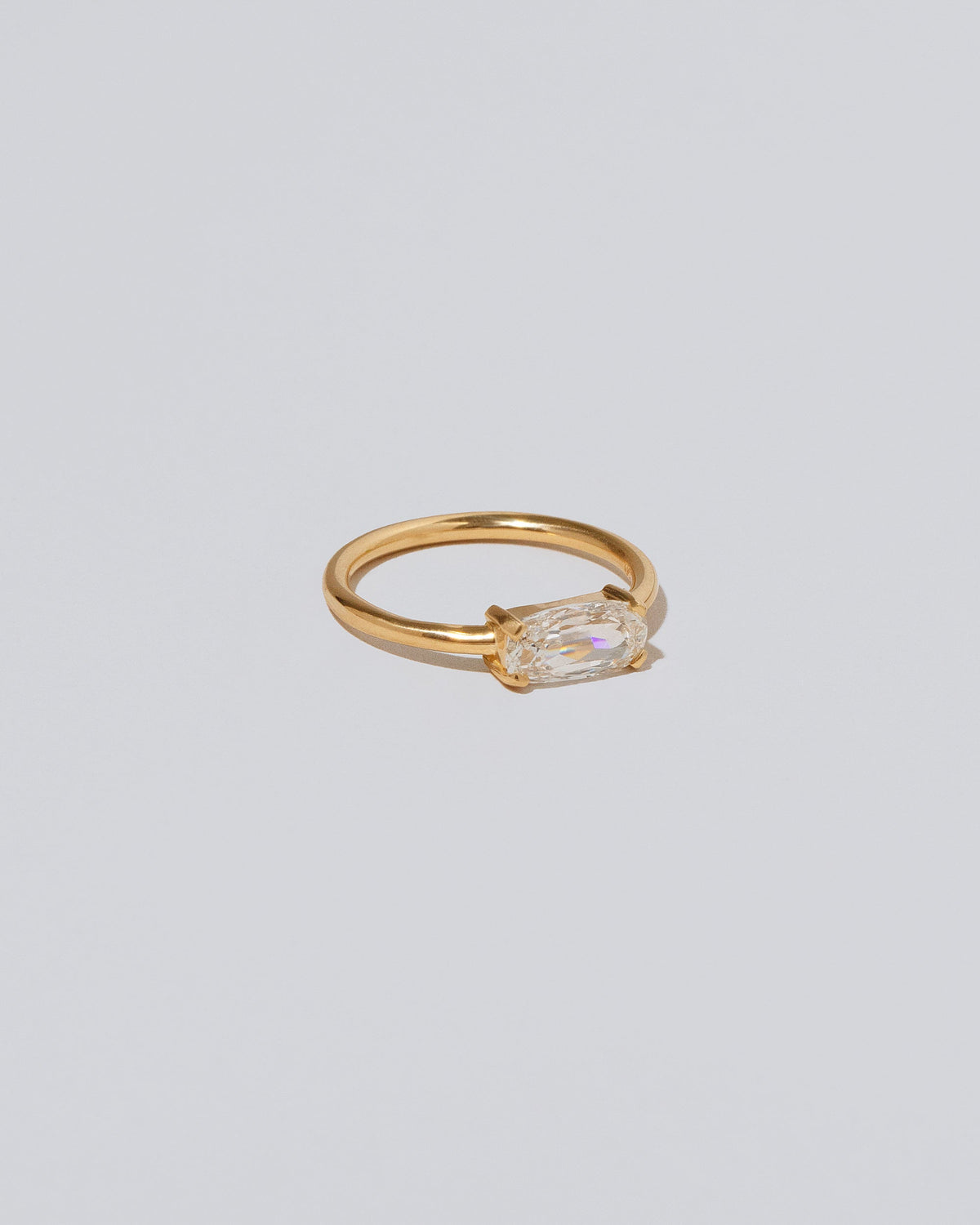 View from the side of the Adage Ring on light color background.