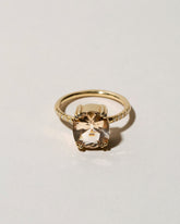 Morganite Solitaire Ring on light color background.