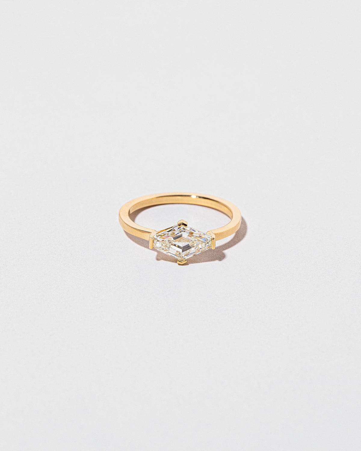 Divine Geometry Ring on light color background.