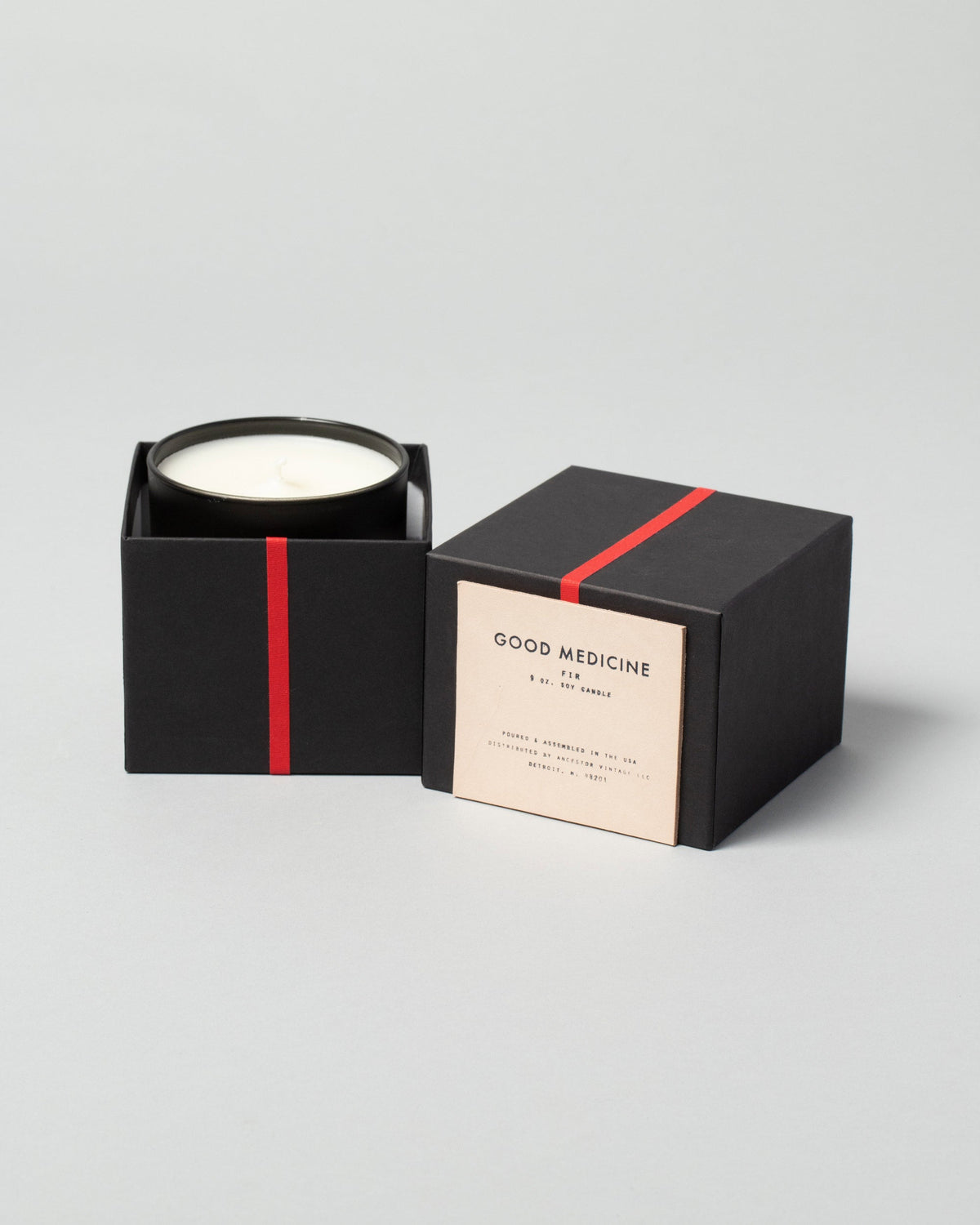 Good Medicine Fir Candle on light color background.