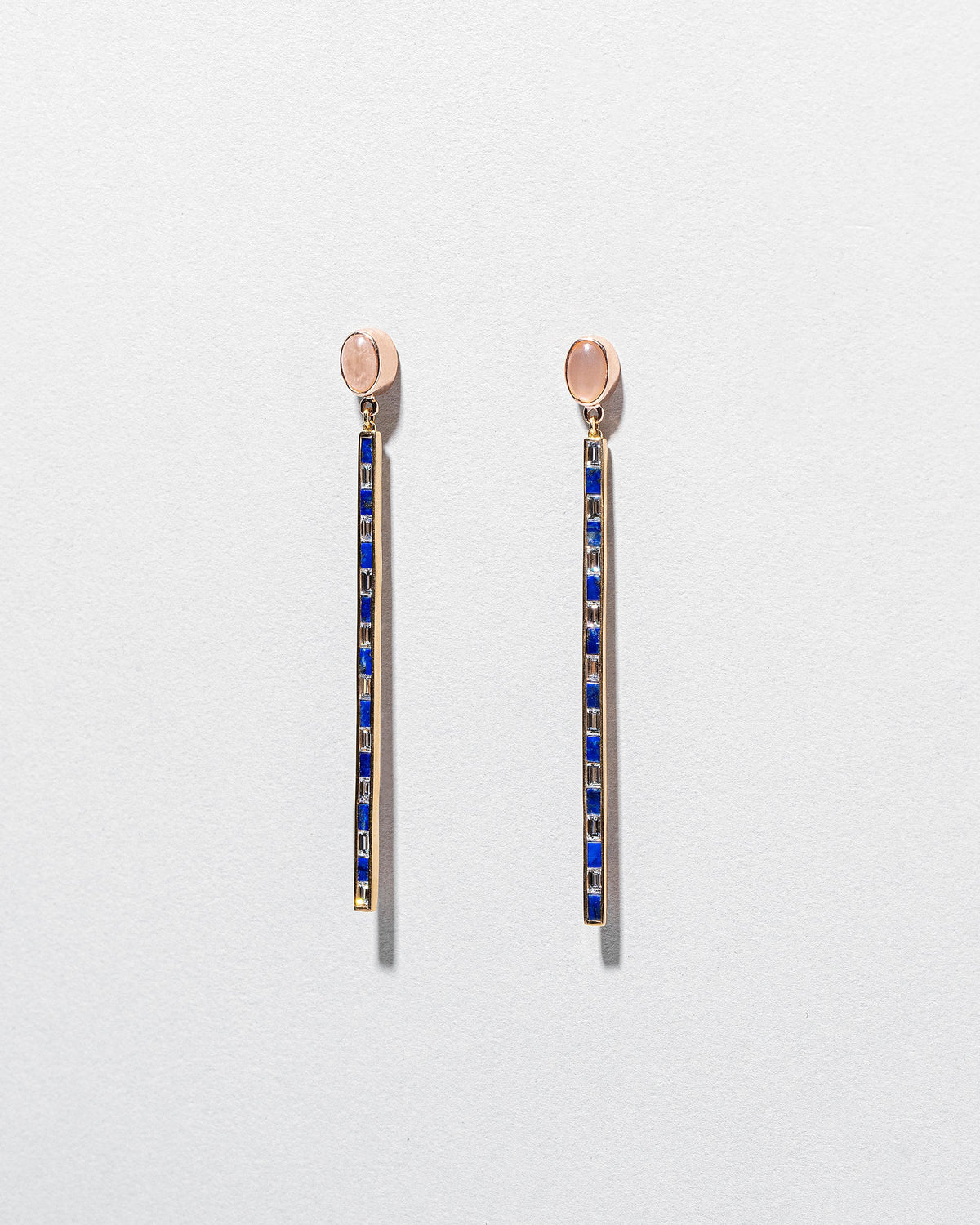  Peach Moonstone Transformation Earrings on light color background.