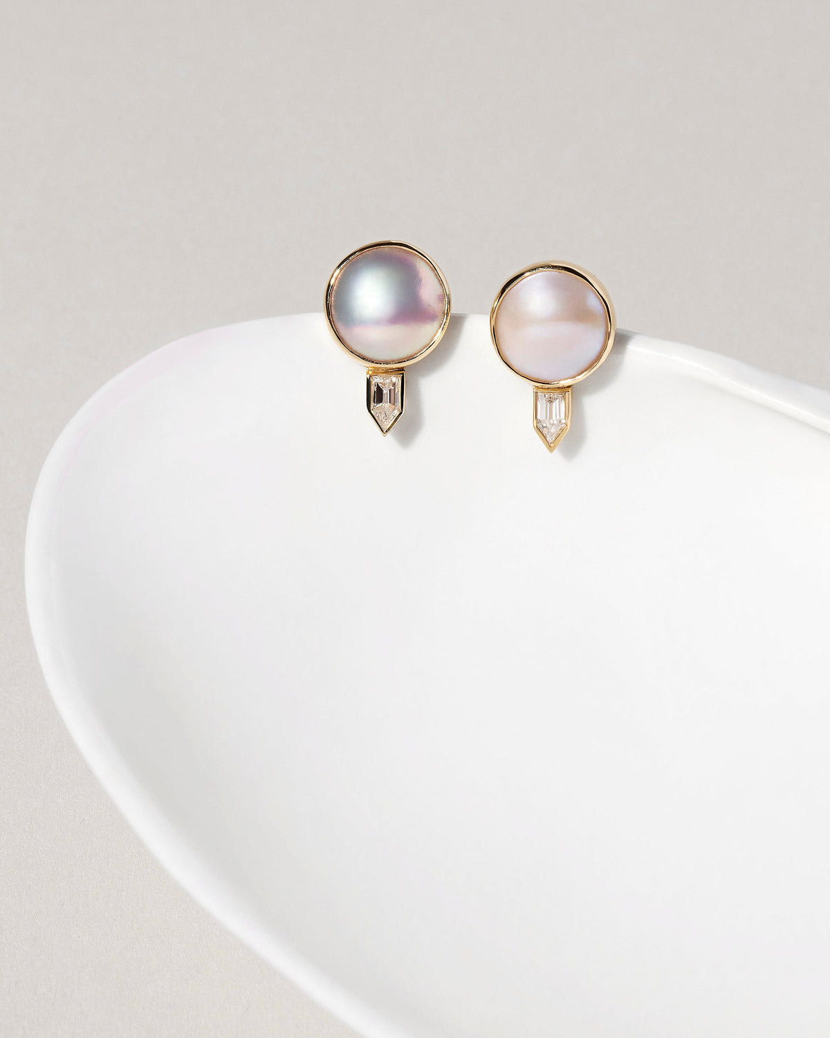  Mabe Pearl & Diamond Earrings on light color background.