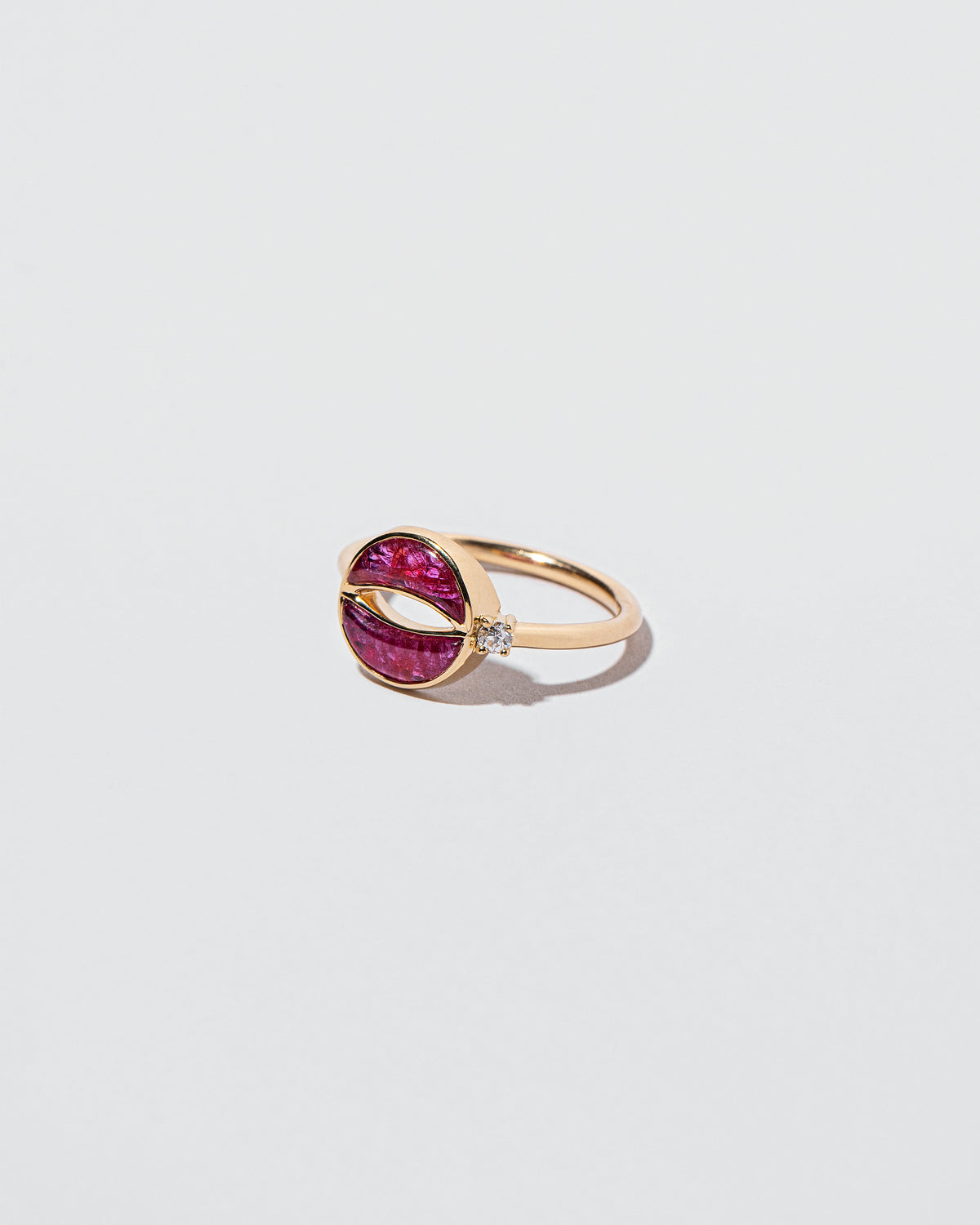 Closeup details of the Rebirth Ring on light color background.