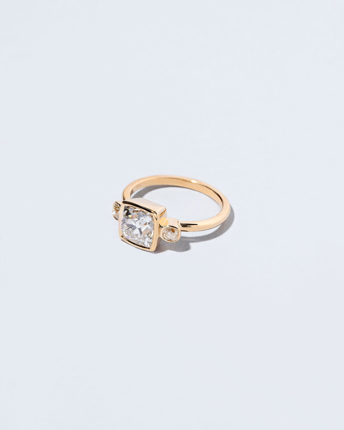  Genesis Ring on light color background.