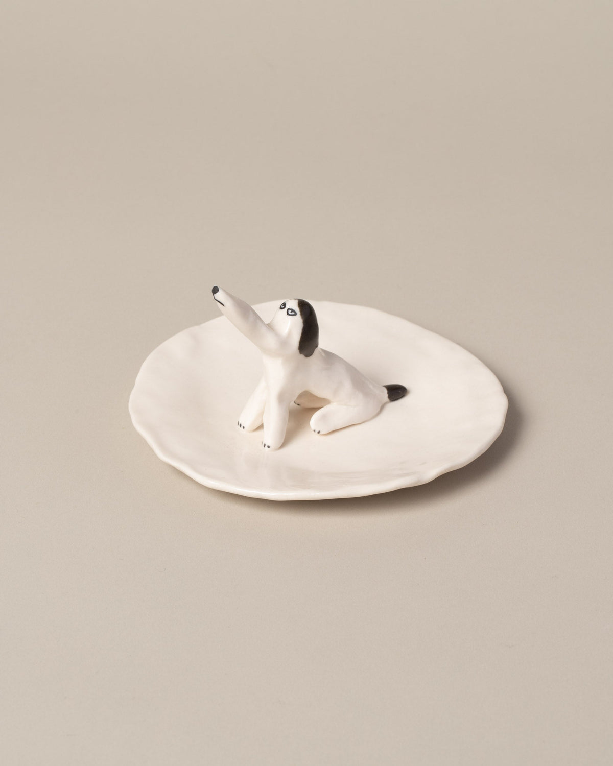 Closeup detail of the Eleonor Boström Dog Ring Dish on light color background.