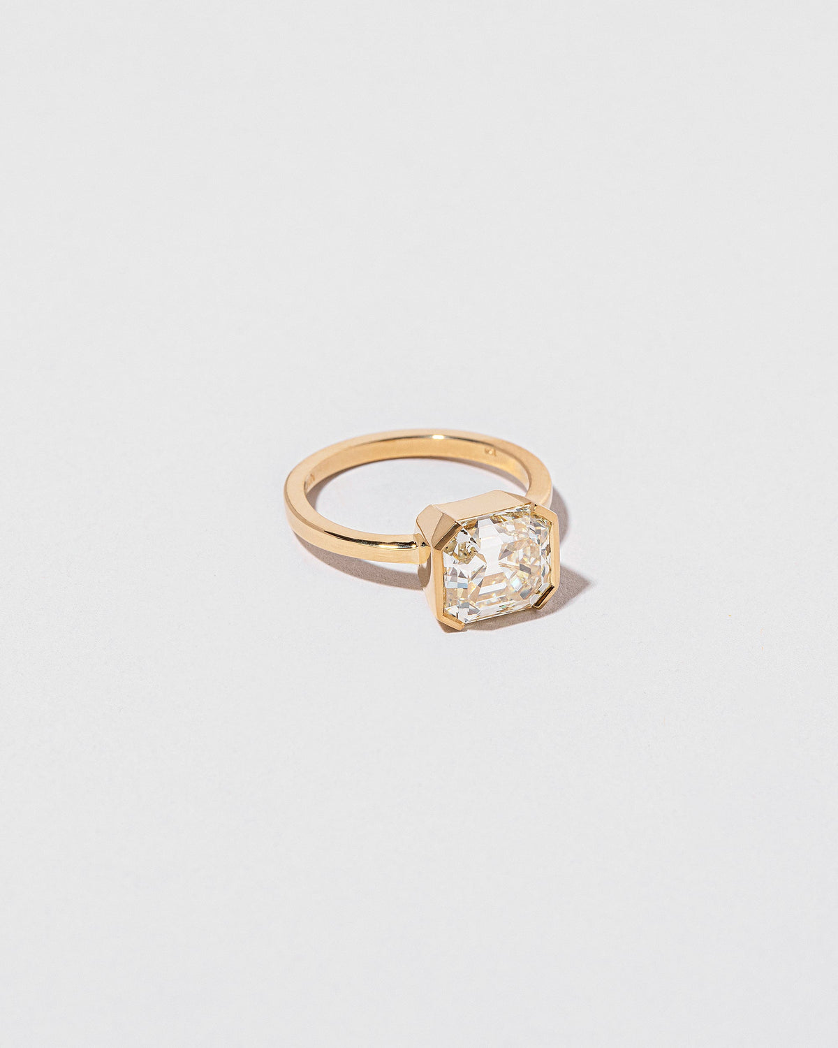 View from the side of the Future Past Ring on light color background.