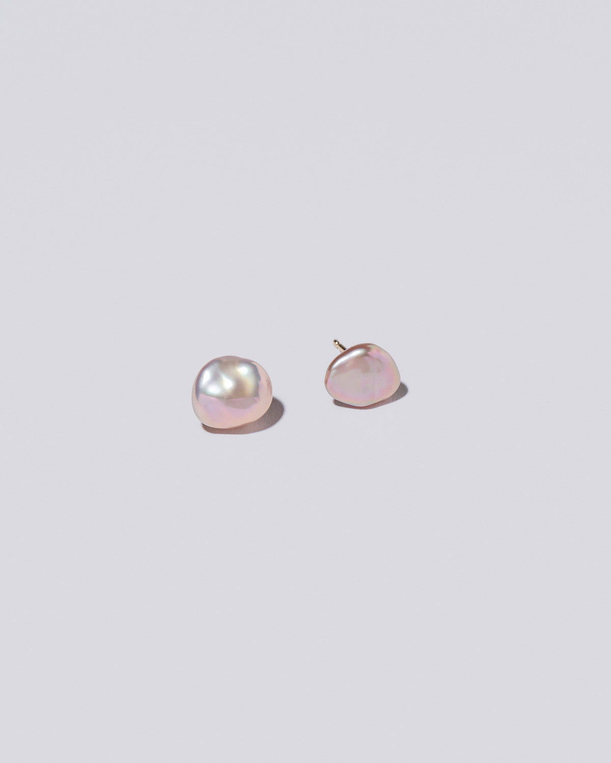  Lagniappe Pearl Stud Earrings on light color background.