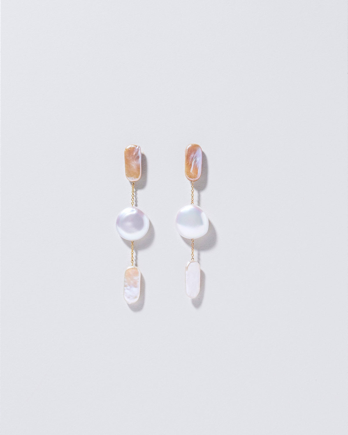  Theseus Earrings on light color background.