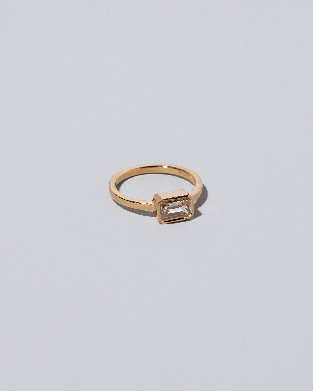 View from the side of the Spectrum Ring on light color background.