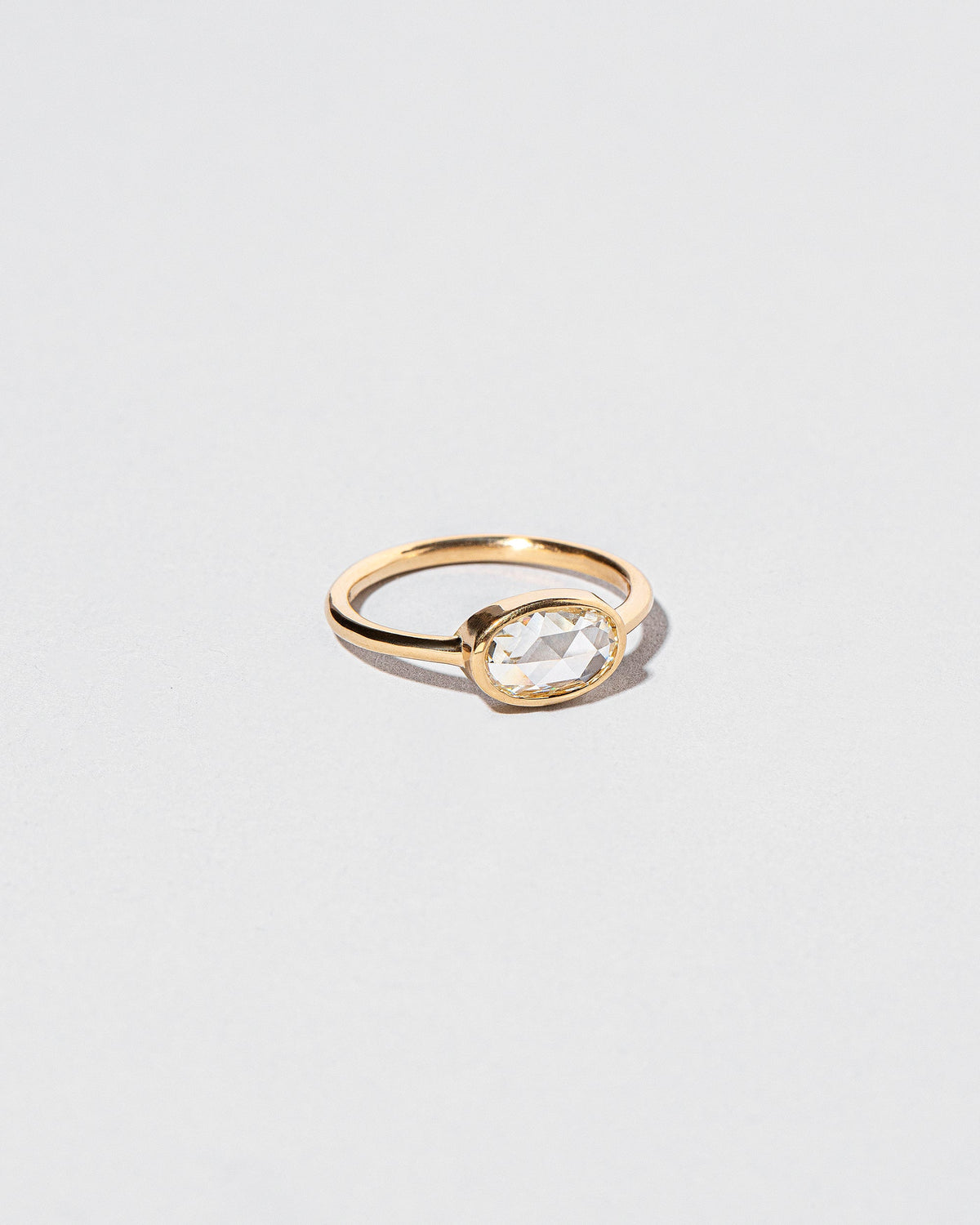 View from the side of the Moly Ring on light color background.