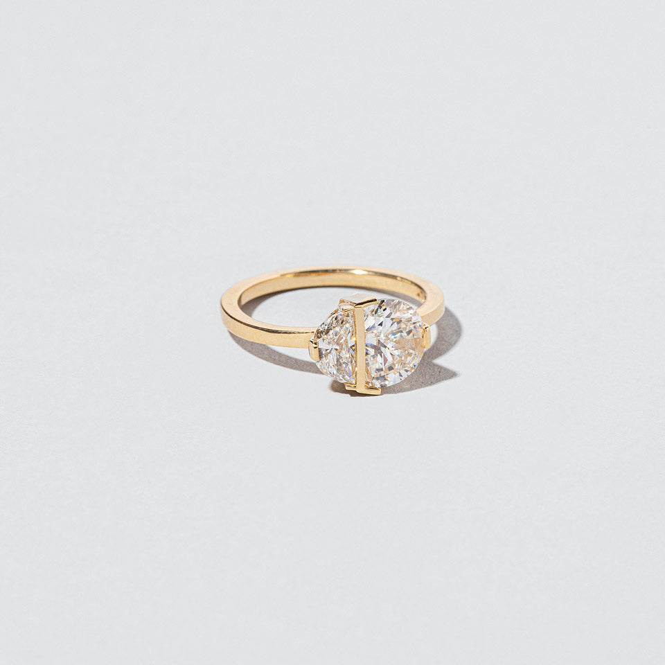 product_details:: Many Worlds Ring on light color background.