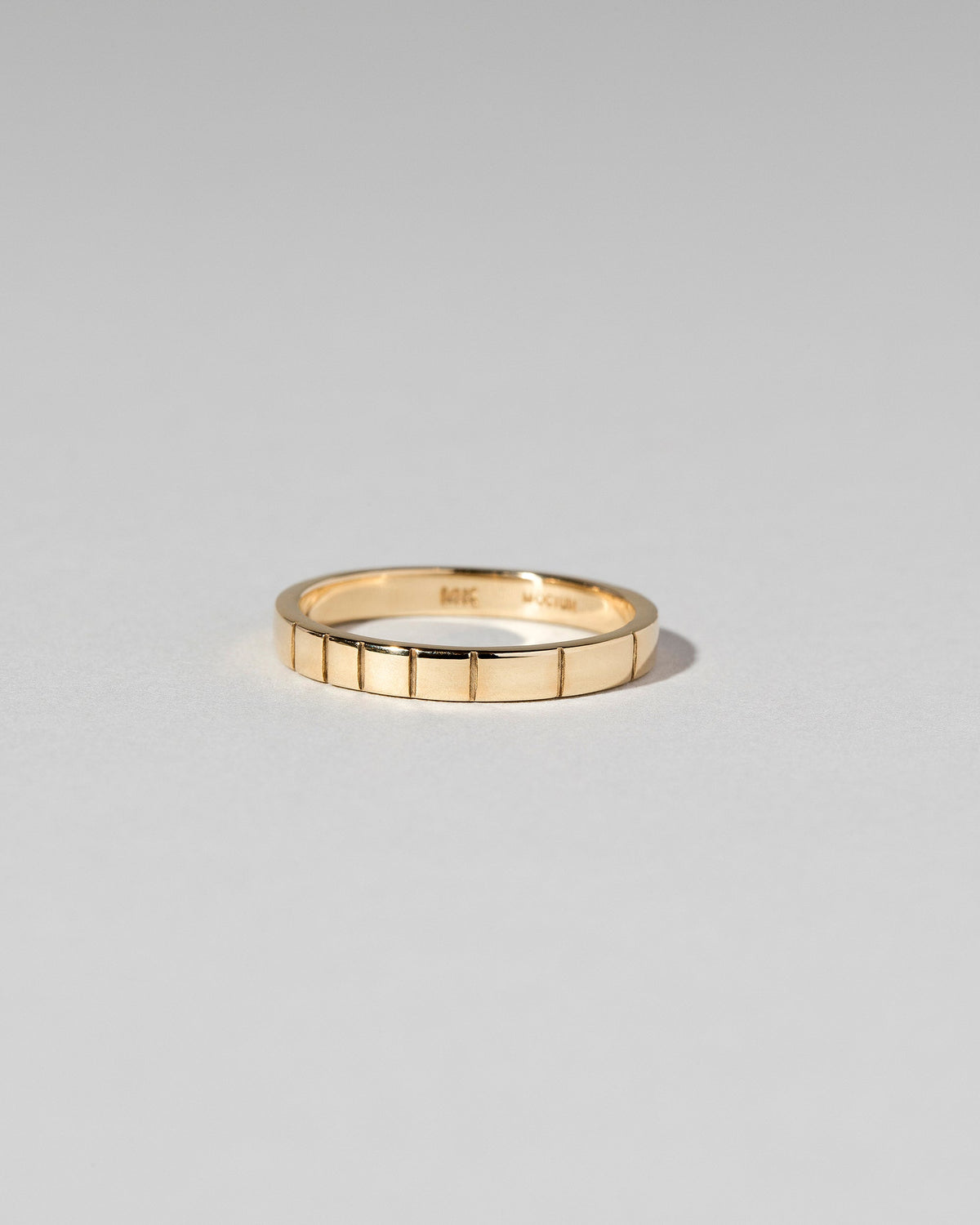 Gold 2.5mm Etched Lines Bands on light color background.