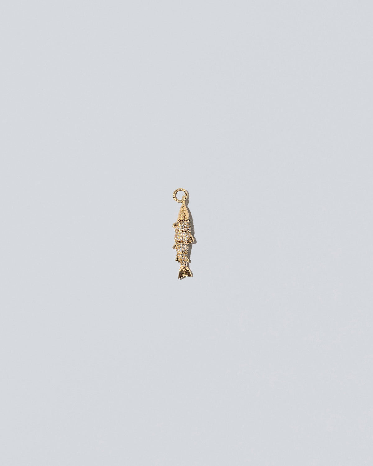 Pavé Fish Charm on light color background.