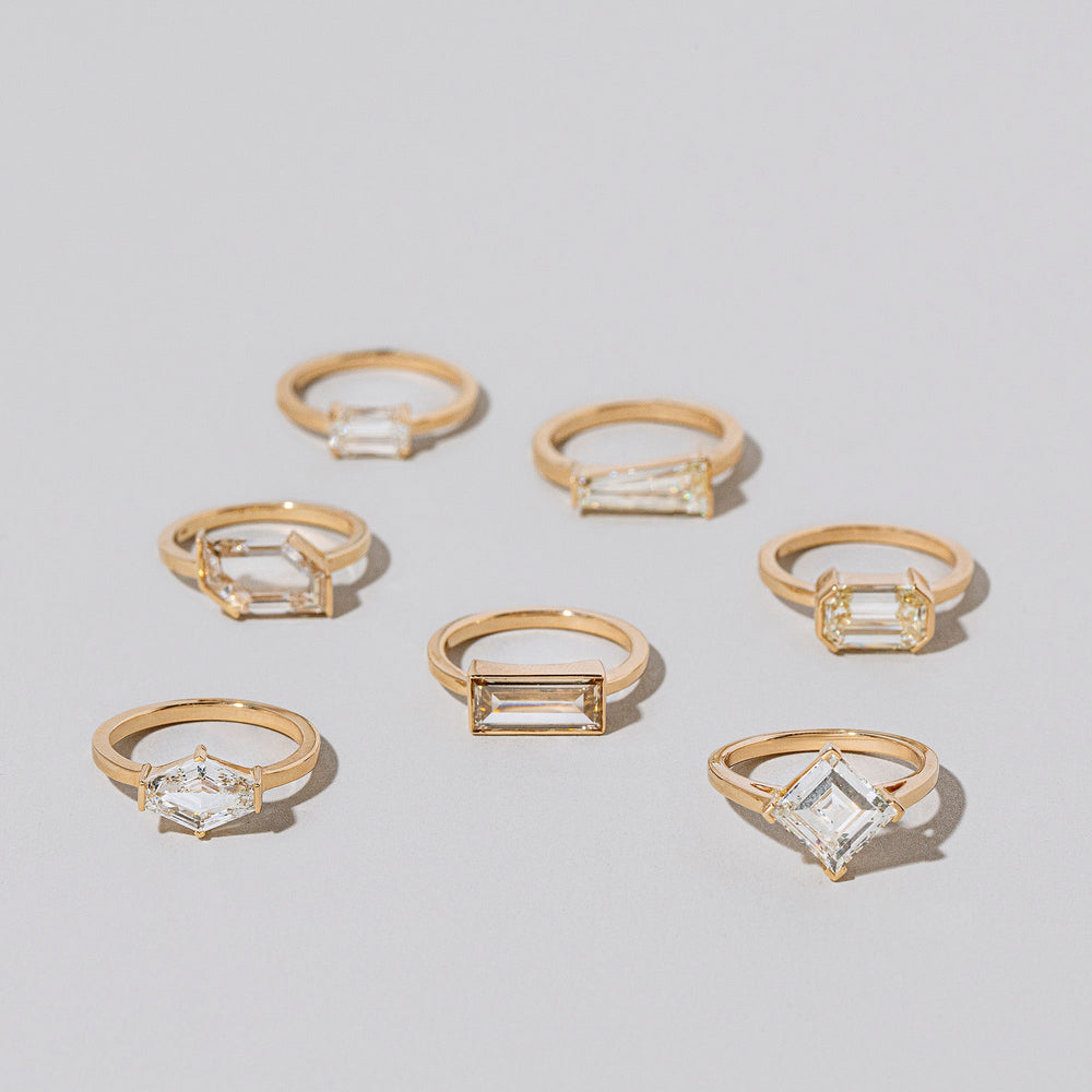 product_details::Group of Thousand Rings on light color background.