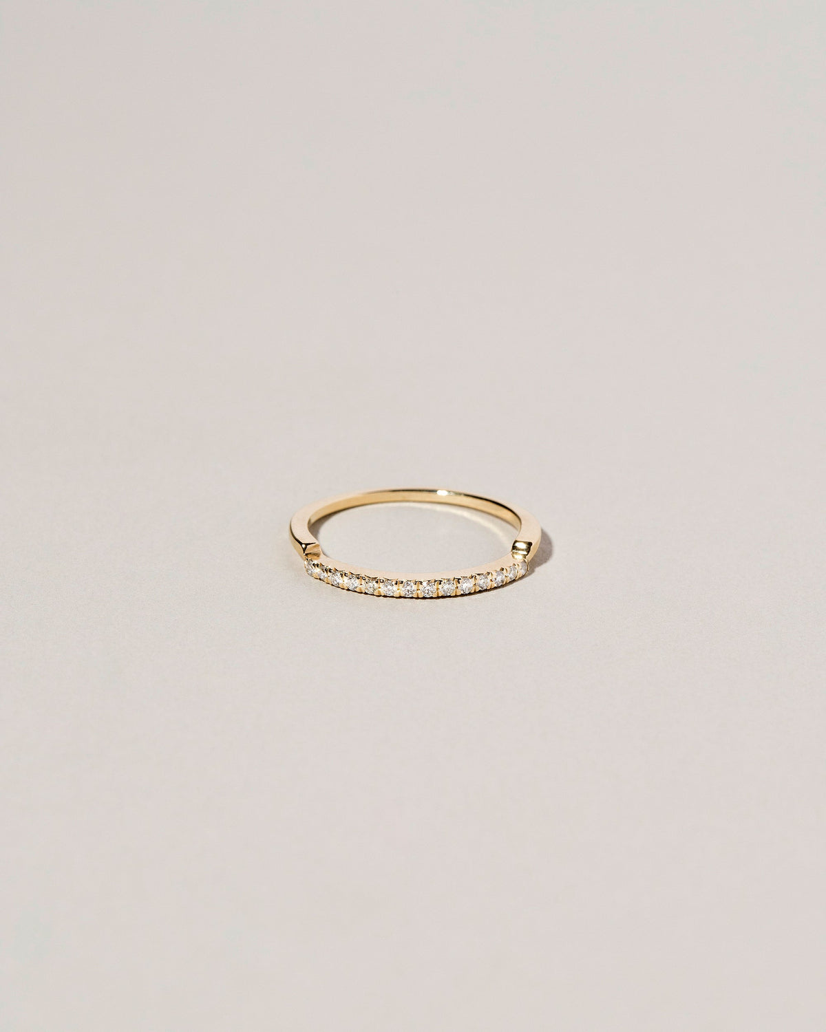 Gold Notched Band on light color background.