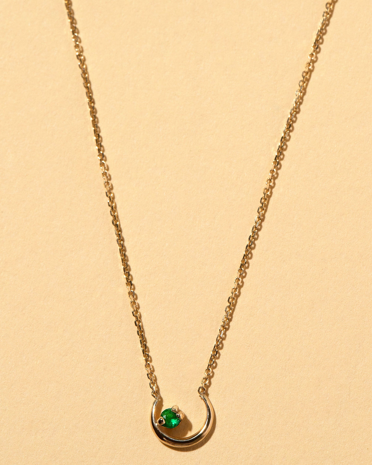  Moon Ray Necklace on light color background.