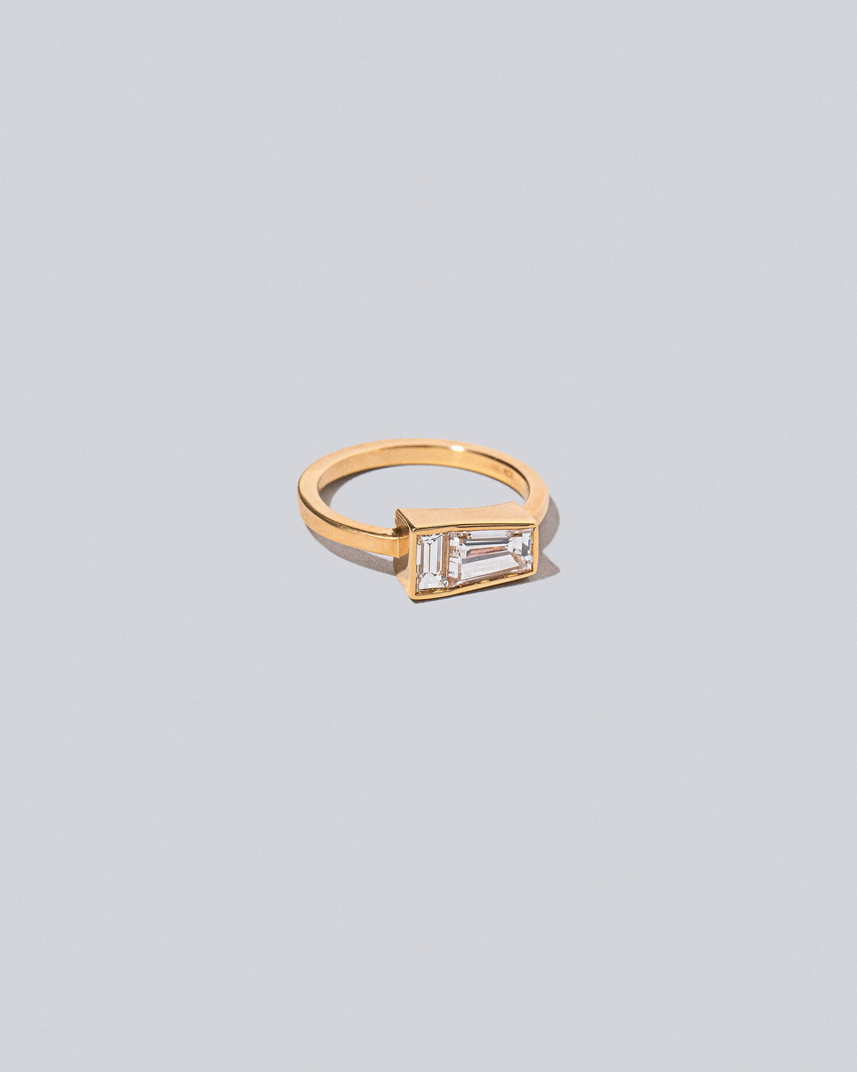 View from the side of the Ode Ring on light color background.