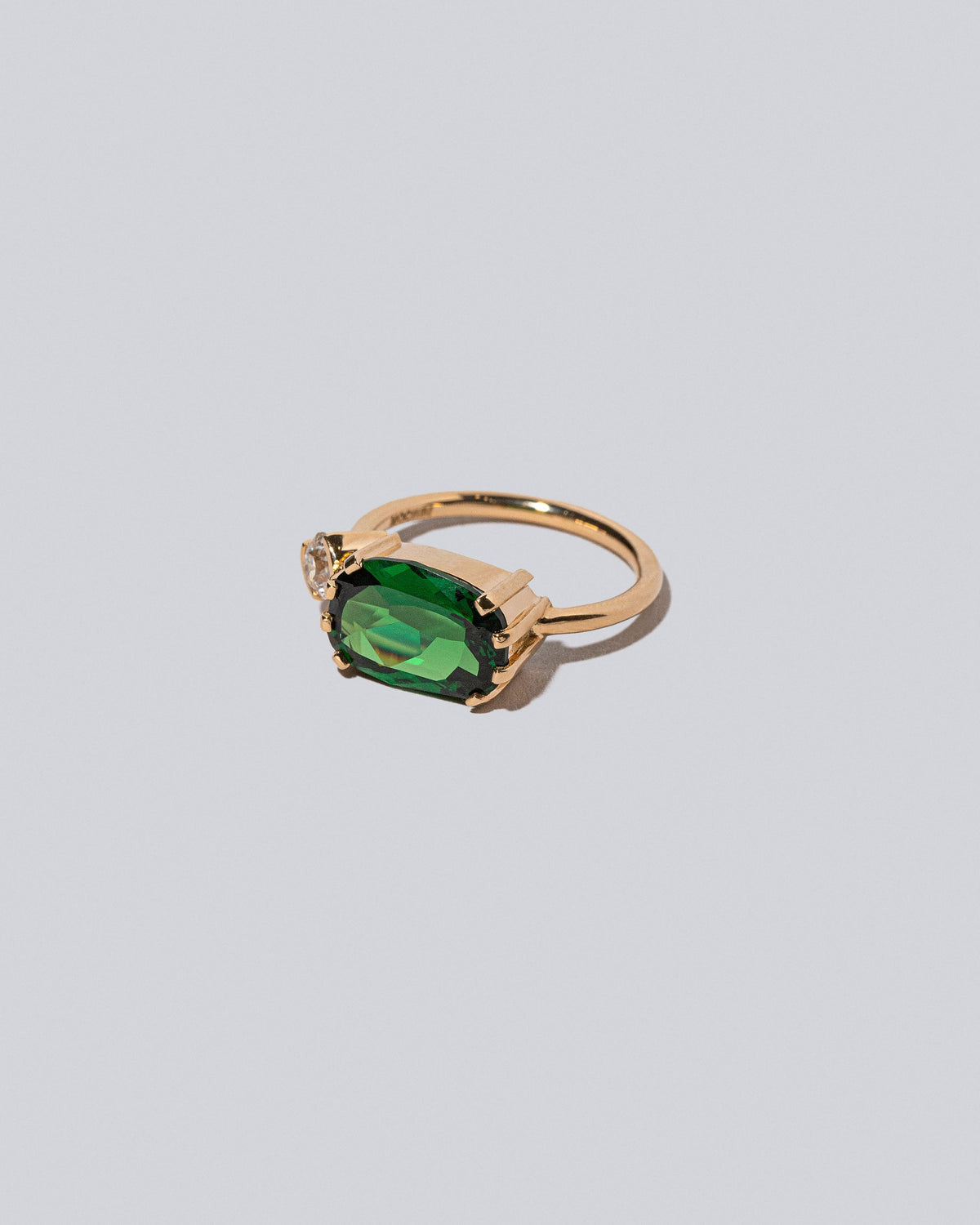 Product photo of the Datura Ring on a light color background 