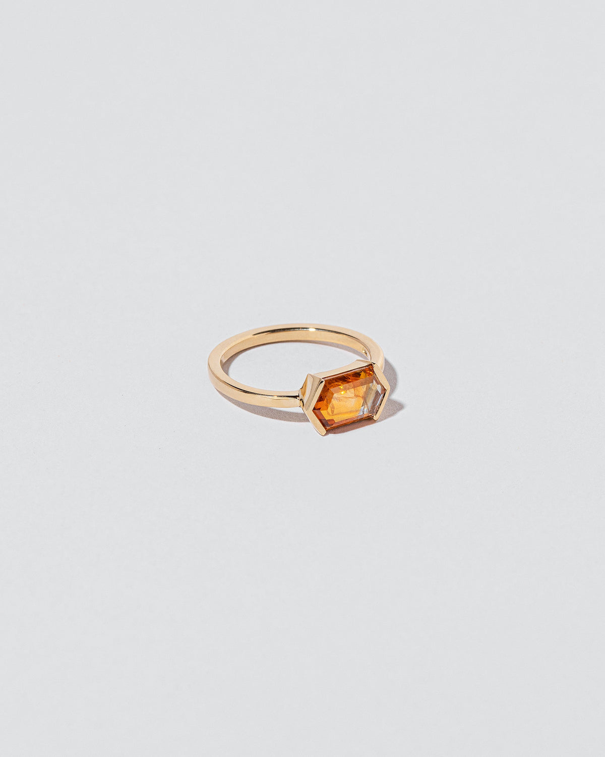 View from the side of the Dawnstar Ring on light color background.