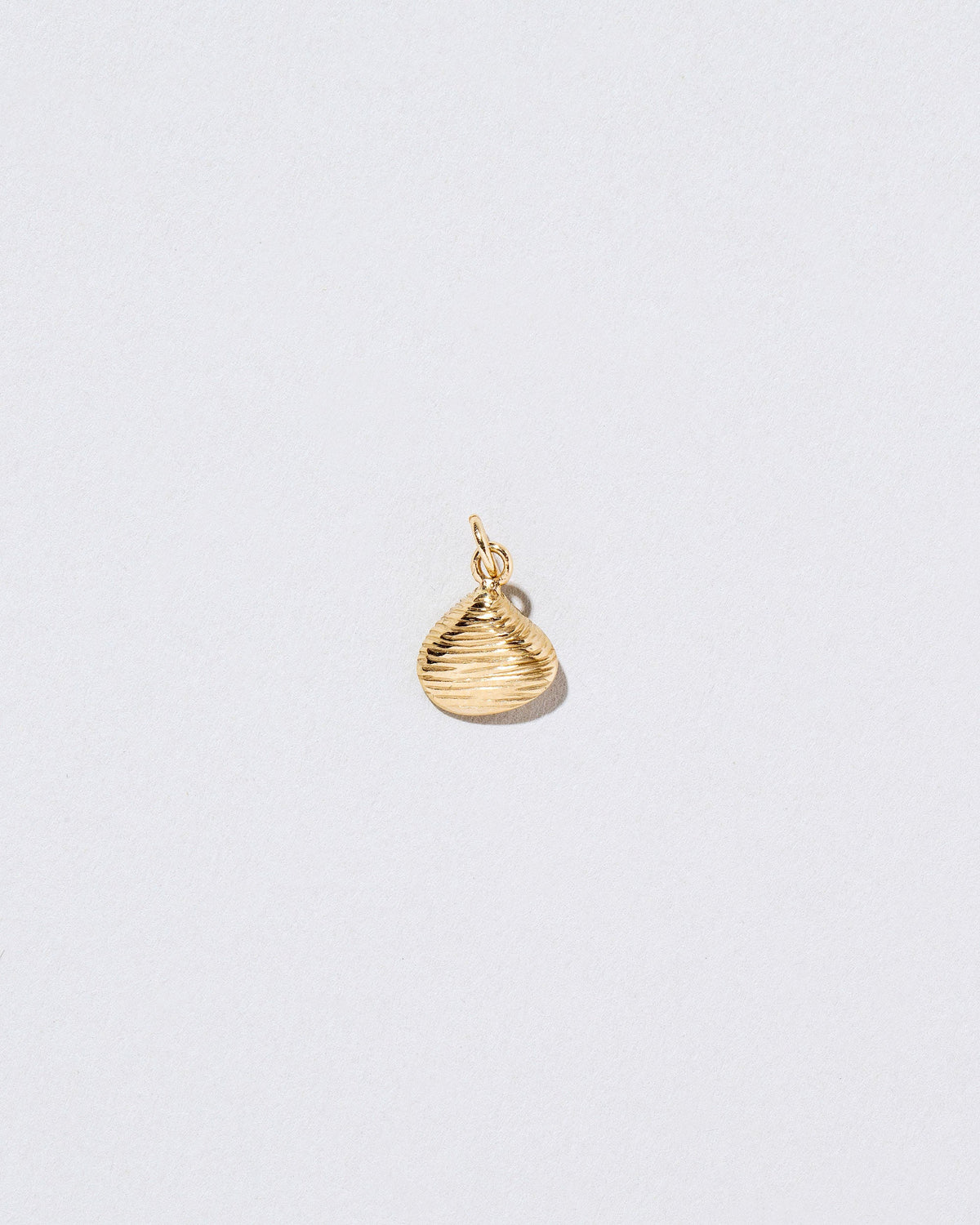  Clams Casino Charm on light color background.