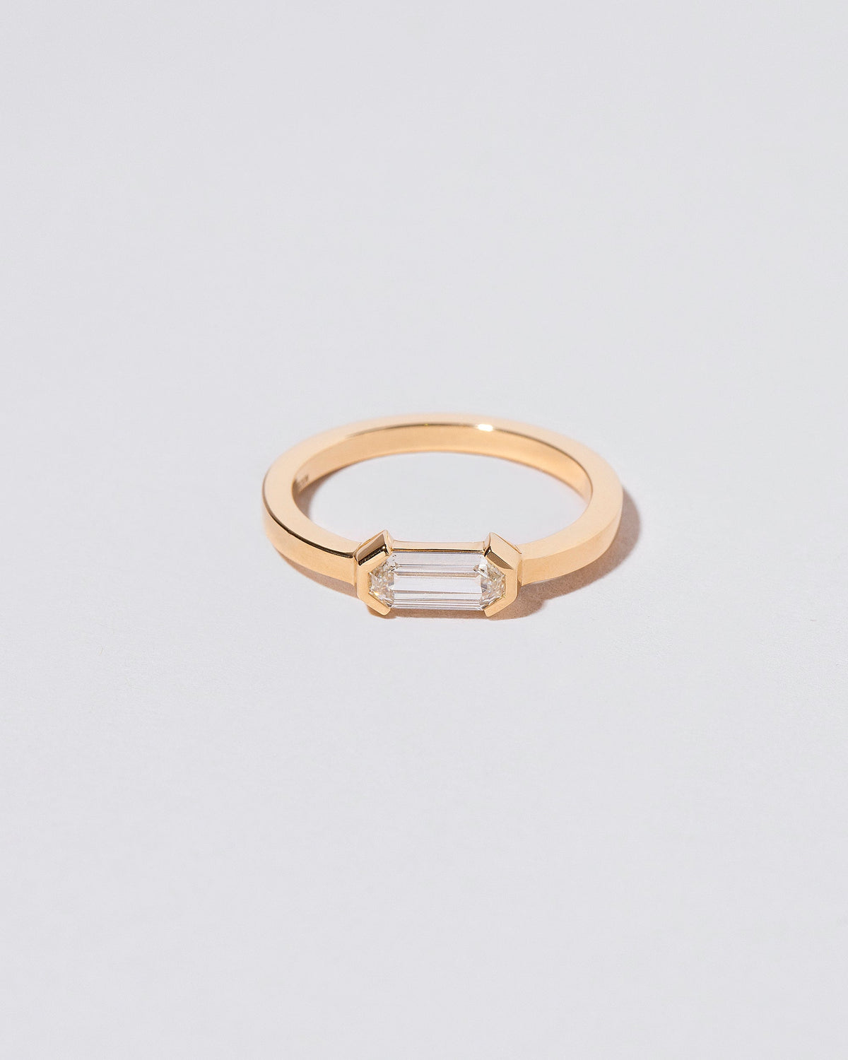 Alcon Ring on light color background.