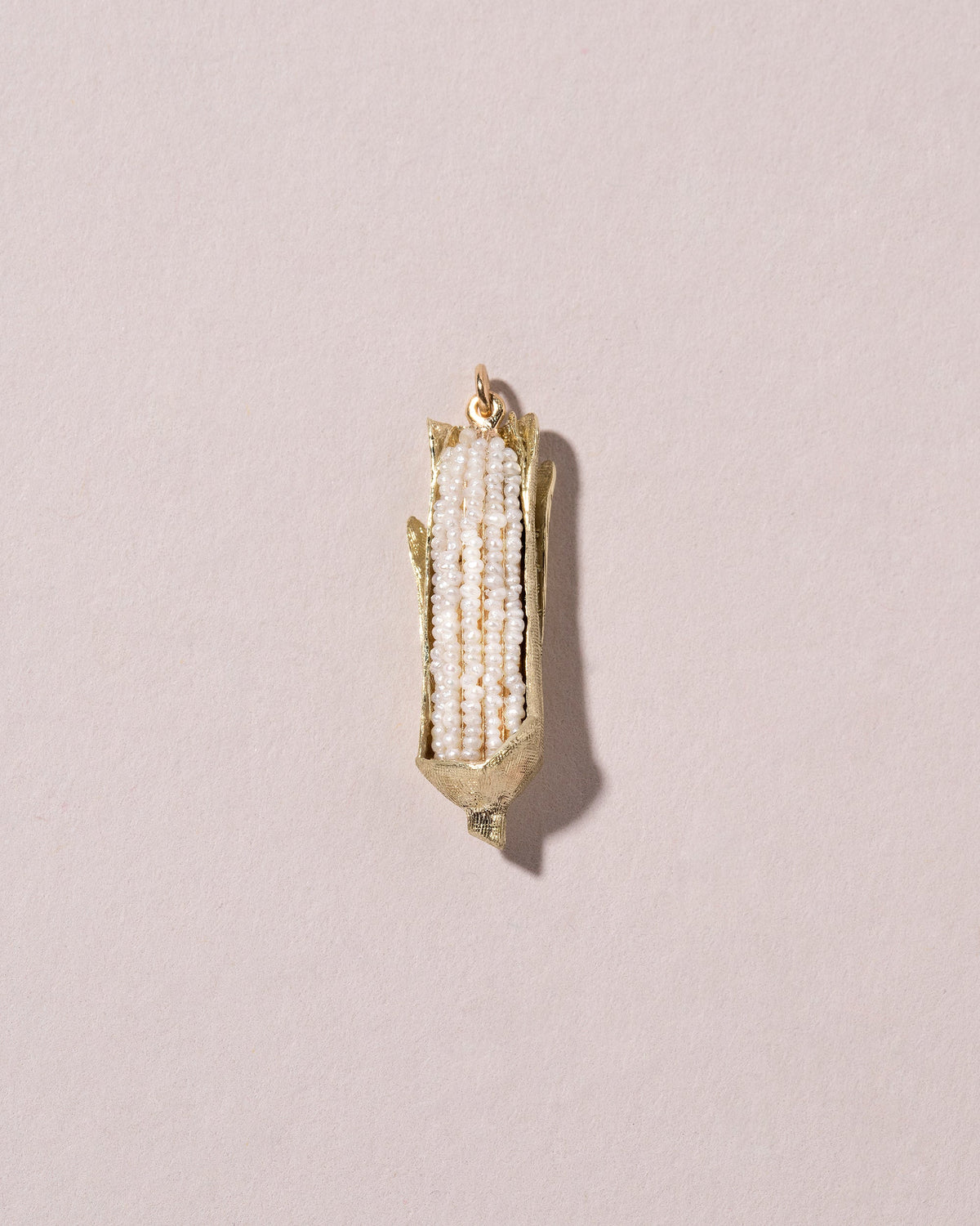  Corn on the Cob Charm on light color background.
