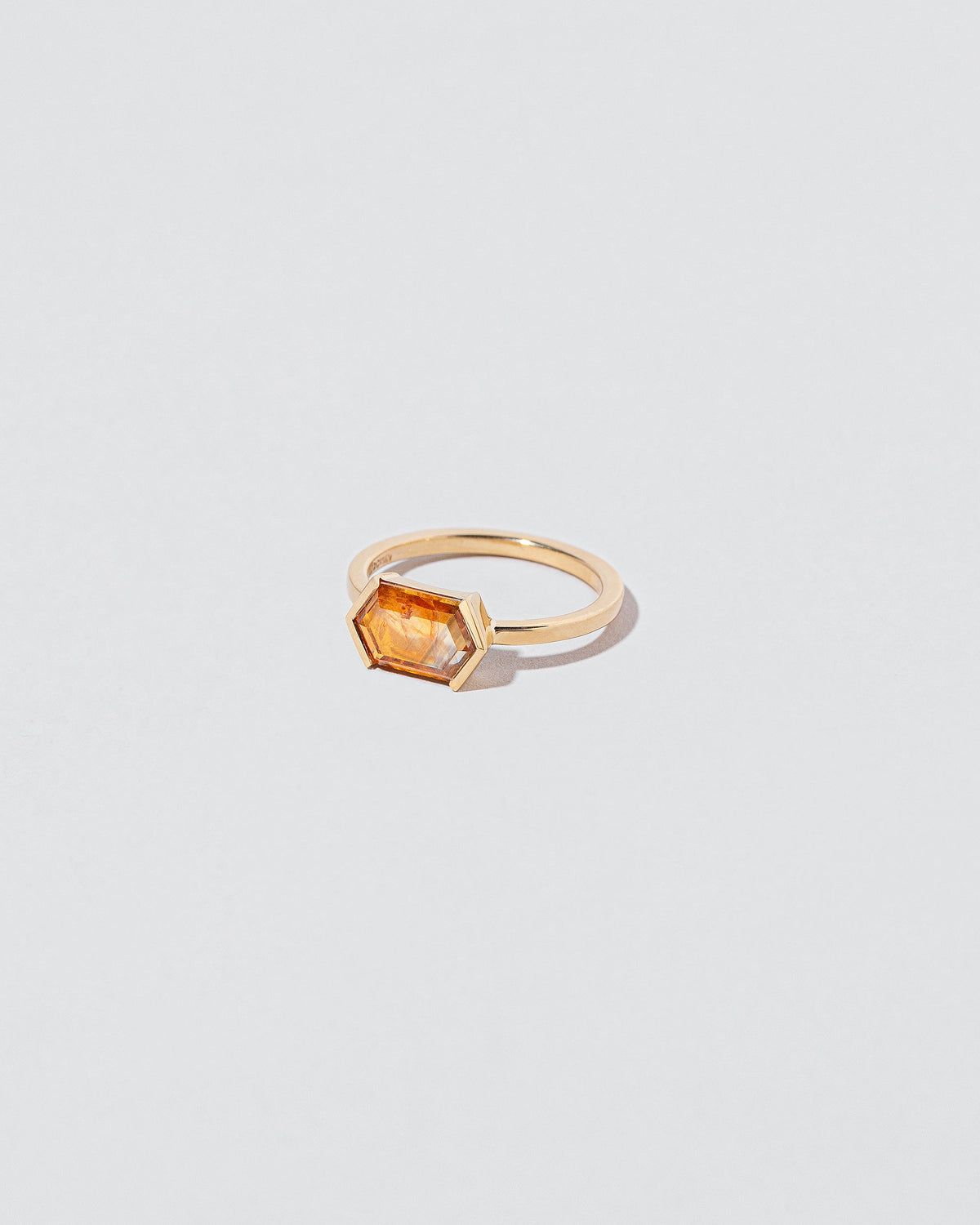 View from the side of the Dawnstar Ring on light color background.