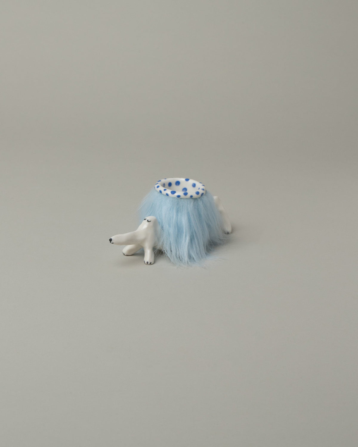 Eleonor Boström Blue Furry Baggage Dog on light color background.