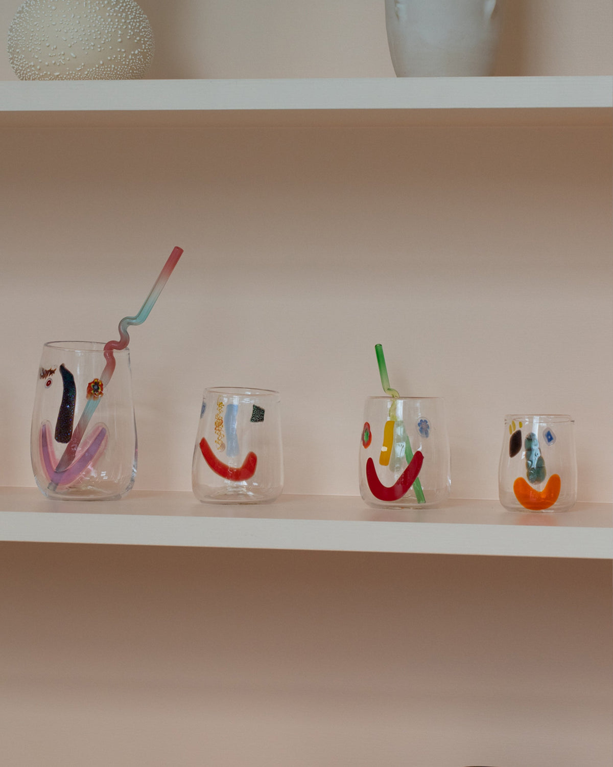 Group of FACEVESSEL Face Glasses on light color background.