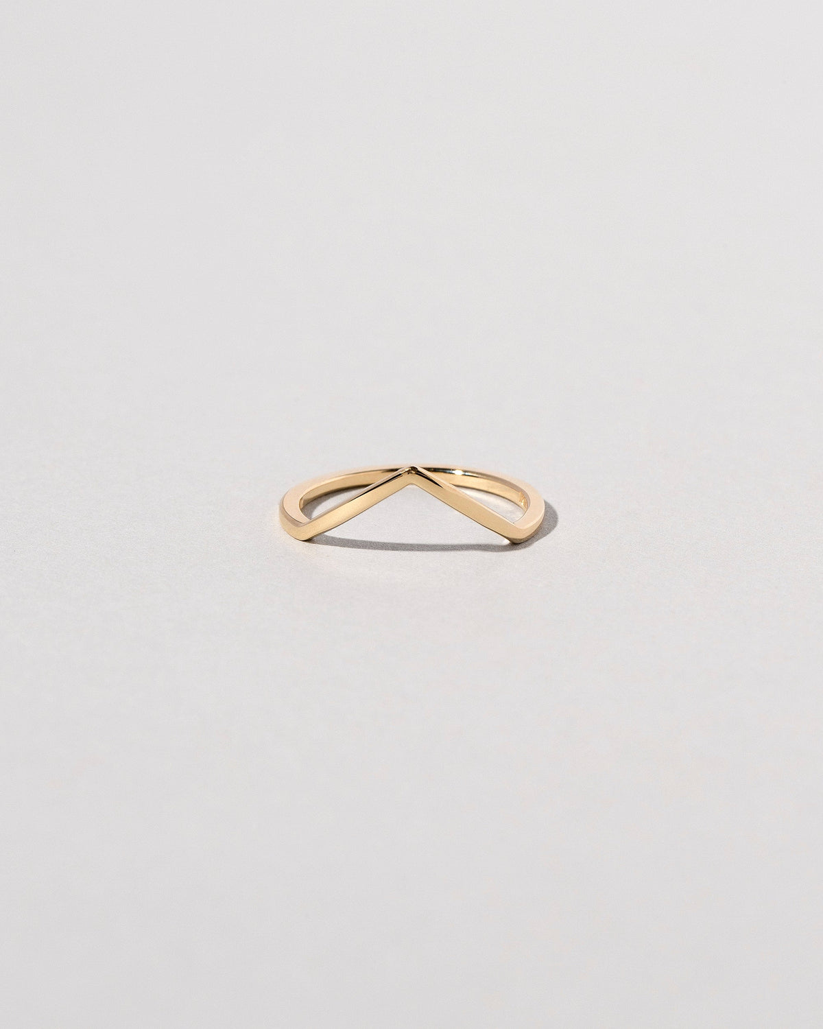 Gold Solid Square Wire High Peak Band on light color background.